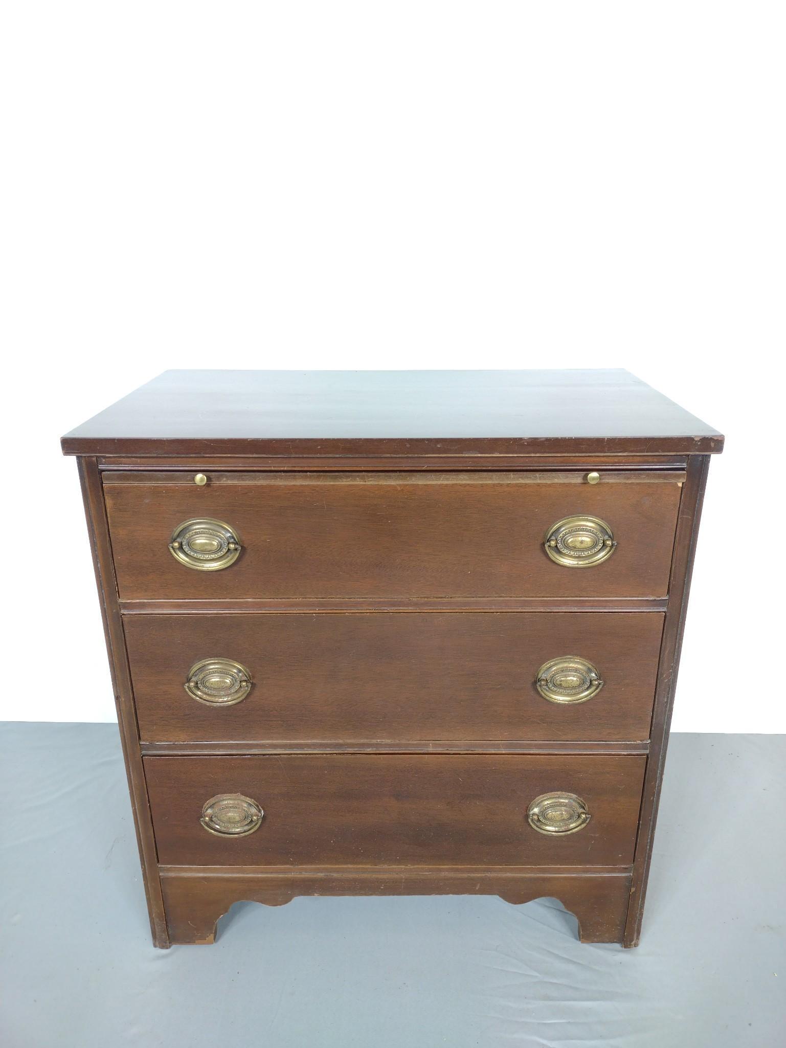 3 Drawer Bachelors Chest: 28" wide X 16" deep X 30" high. Has scratches. No manufactures name found. MG. Provenance: From the estate of Mary Trost who last resided in the multi generational family home located in Clarks Valley