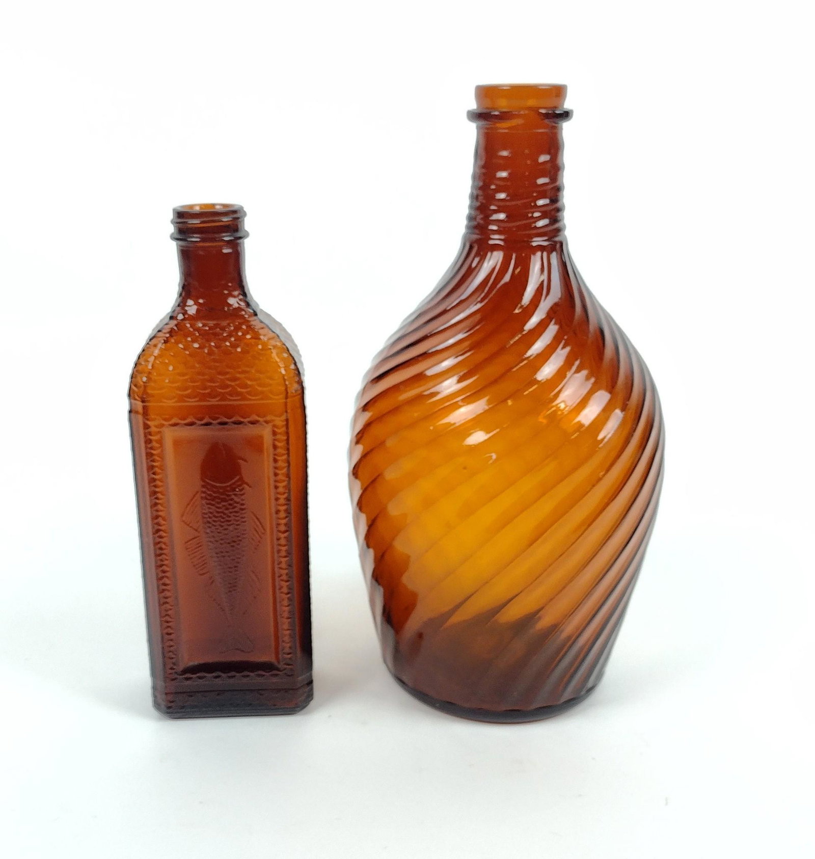 2 Diamond Glass Company Bottles: Diamond Glass Company of Royersford, PA. 3" to 5-1/2" wide X 9" to 10-3/4" high. MEG Provenance: From the estate of Mary Trost who last resided in the multi generational family home located in Clarks 
