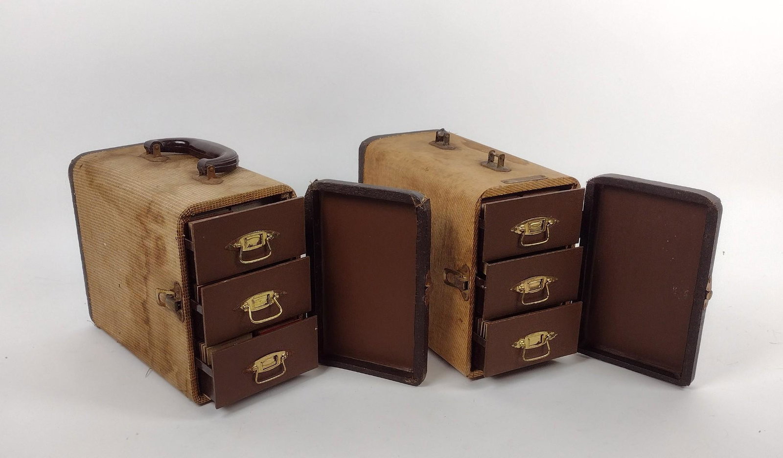2 Barnett Jaffe Slide Holders w/ Slides: Includes 1950's slides of Albert H. Stackpole and family on vacations. Includes images of mountainside, boating, beaches and more. 5" wide X 10-3/4" deep X 8" high. Handle of one missing. MEG Provenan