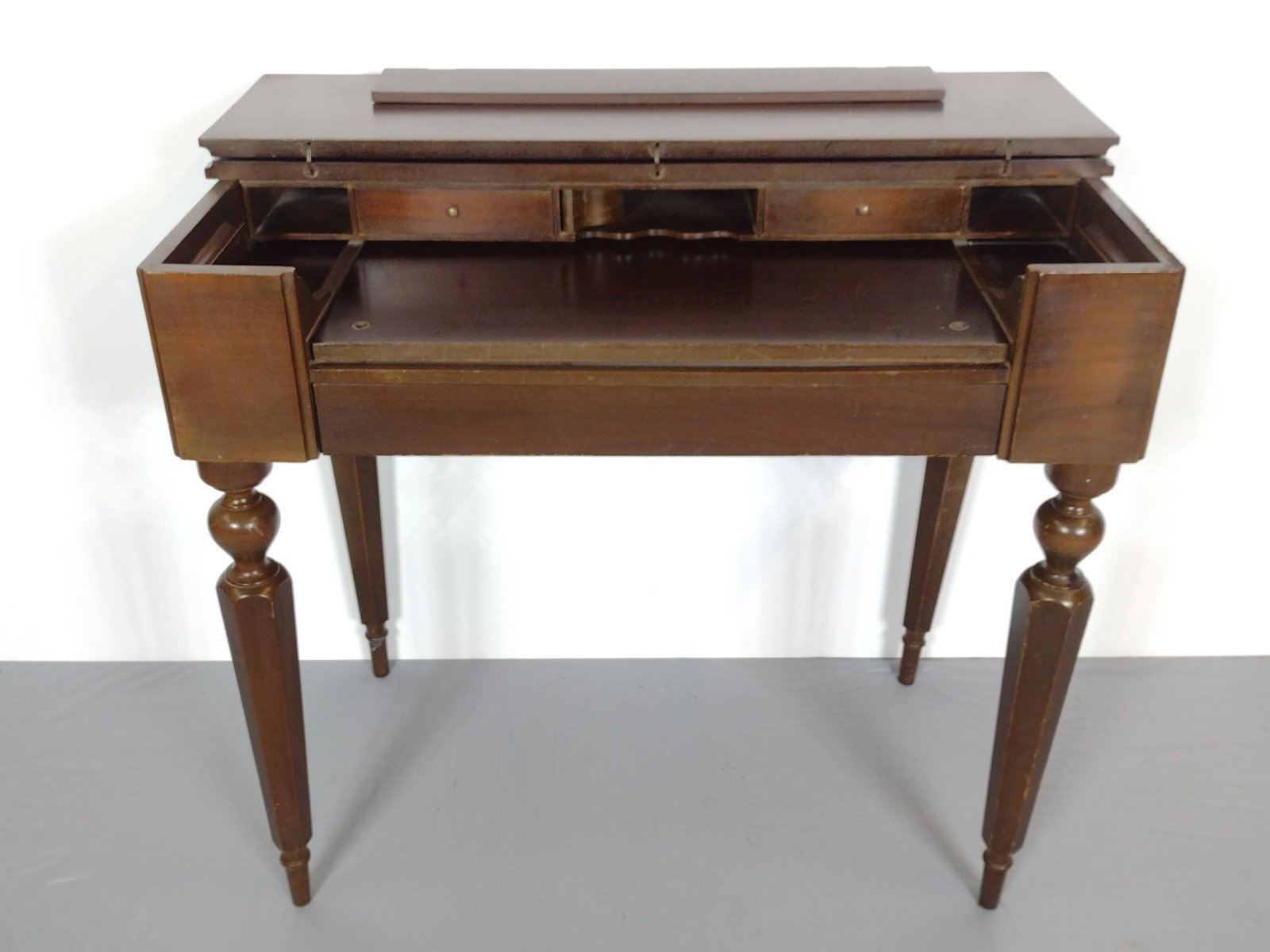 Spinnet Desk: 36" wide X 26-1/2" deep X 33" high. Has scratches and finish loss. MG. Provenance: From the estate of Mary Trost who last resided in the multi generational family home located in Clarks Valley, Dauphi