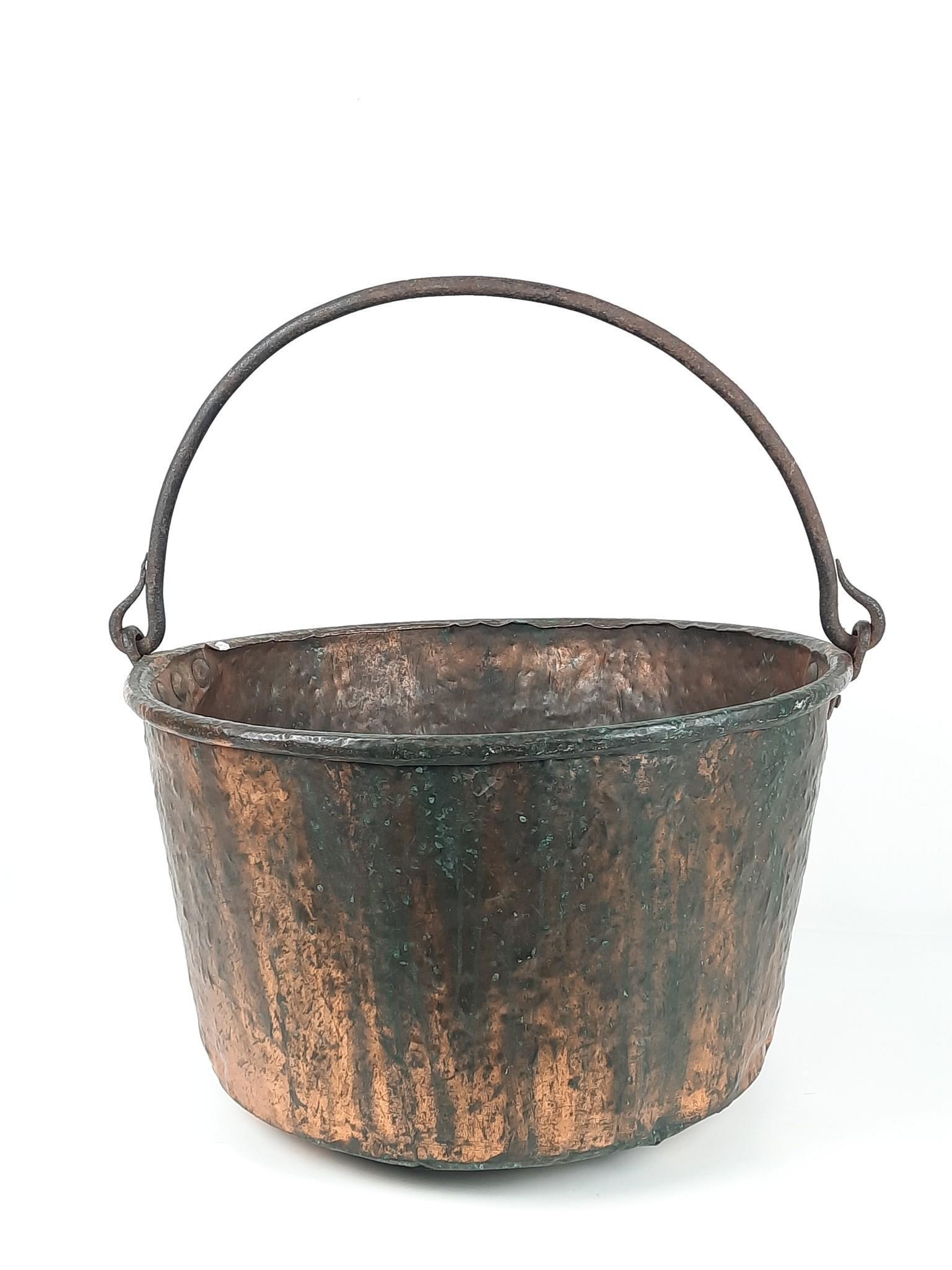 Copper Apple Buttle Kettle: Wrought iron handle. 25" diameter x 26" high. Discoloration and oxidation. LR Provenance: From the estate of Mary Trost who last resided in the multi generational family home located in Clarks Valley,