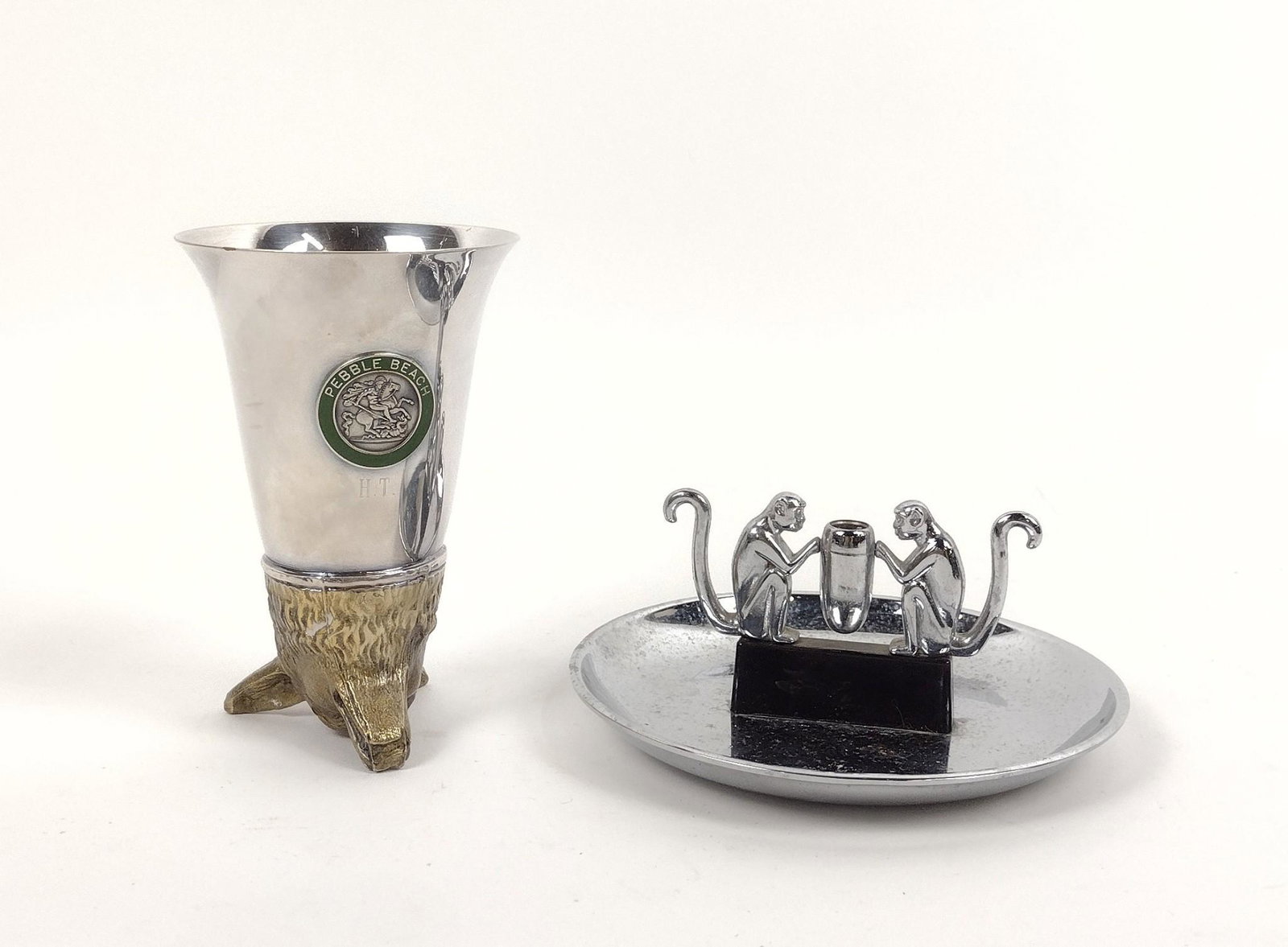 Stirrup Cup & Monkey Ashtray: Hamilton Products Monkey ashtray and Pebble Beach Stirrup Cup. 3-1/4" to 5-3/4" diameter X 3" to 5" high. MEG Provenance: From the estate of Mary Trost who last resided in the multi generational famil
