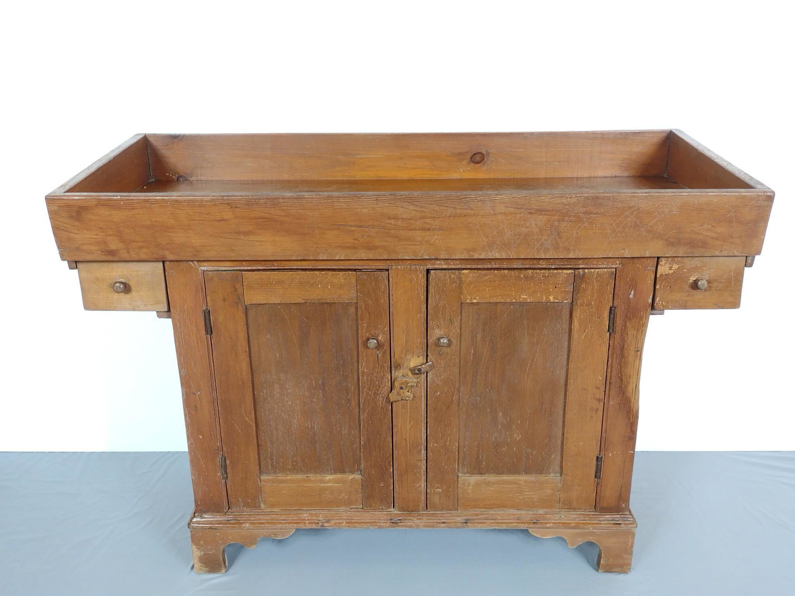 Dry Sink: 50" wide X 20" deep X 34-1/2" high. Has some scratches and finish loss. Right side has heavy scratches to corner. MG. Provenance: From the estate of Mary Trost who last resided in the multi generation
