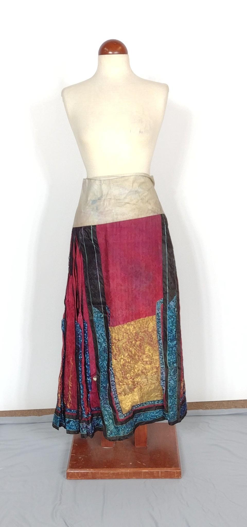 Chinese Embroidered Pleated Skirt: 45" wide X 36-1/4" long. Some tearing along bottom seams. MEG Provenance: From the estate of Mary Trost who last resided in the multi generational family home located in Clarks Valley, Dauphin (Harris