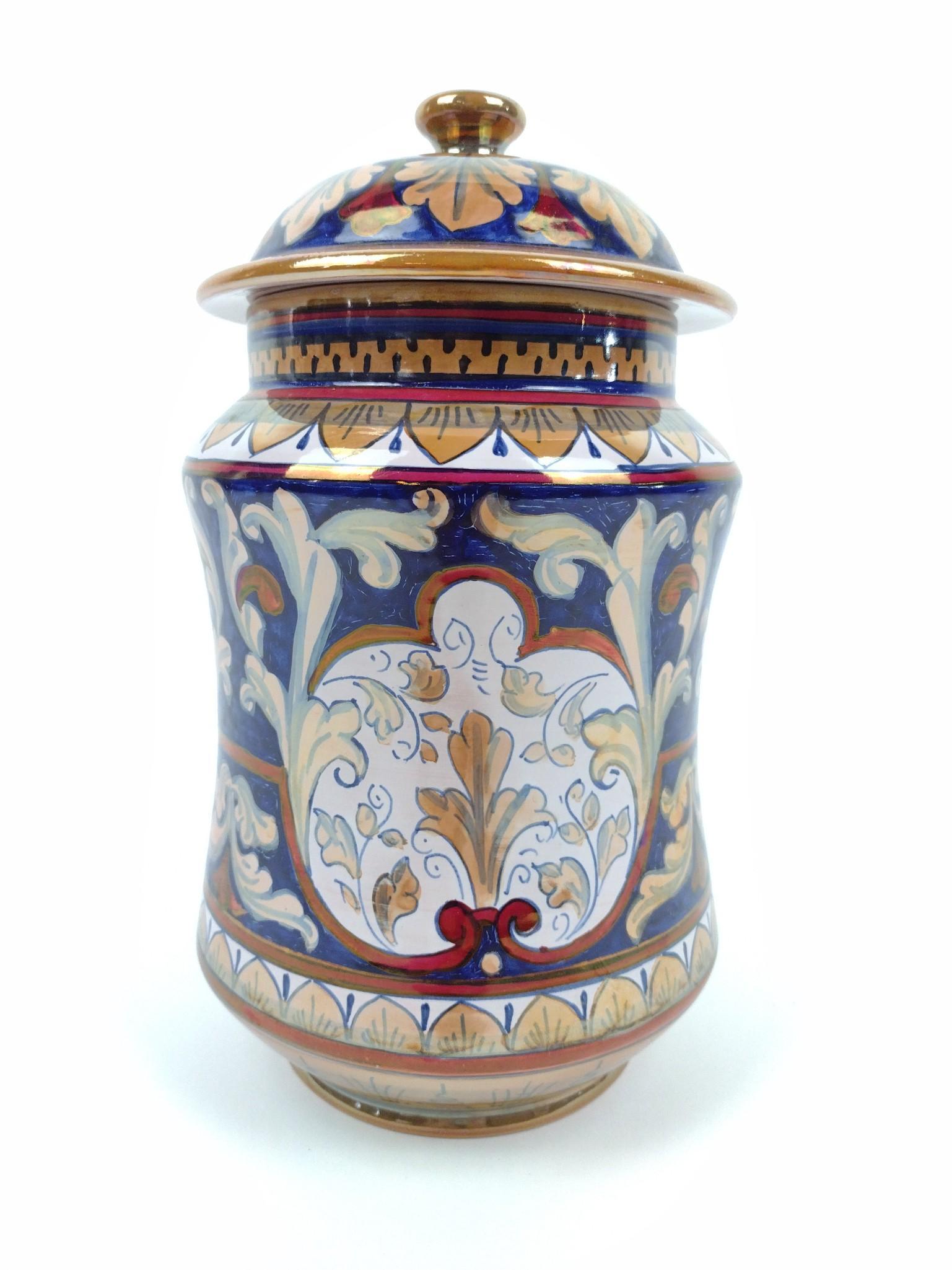 Gualdo Tabino Majolica Canister: 5-1/2" diameter x 10" high. JB IMPORTANT: Before bidding, please read the terms and conditions. When you registered for the auction you agreed to these terms and will be required to comply with them.