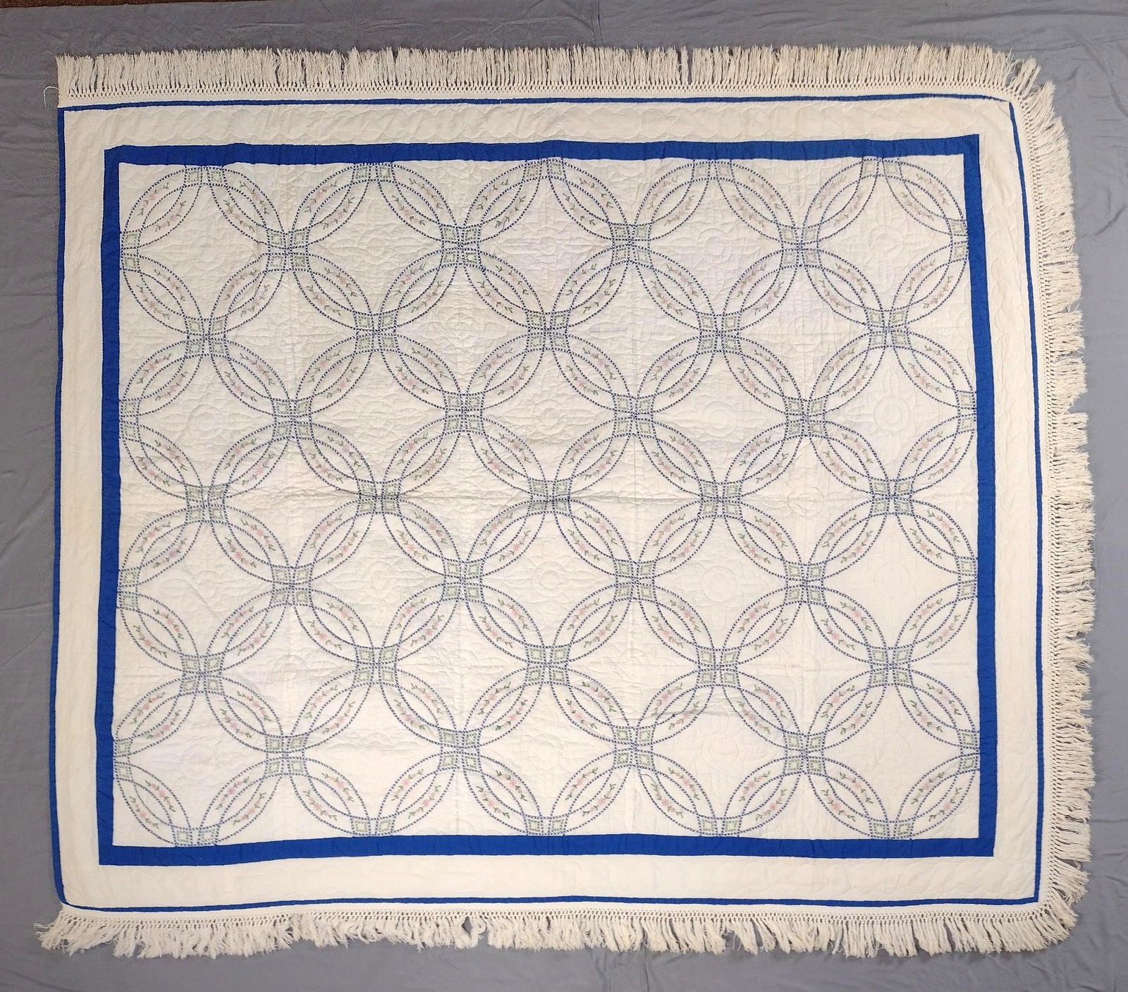 Wedding Ring Quilted Blanket: 7'6" wide X 6'5" long. Some staining. MEG IMPORTANT: Before bidding, please read the terms and conditions. When you registered for the auction you agreed to these terms and will be required to comply
