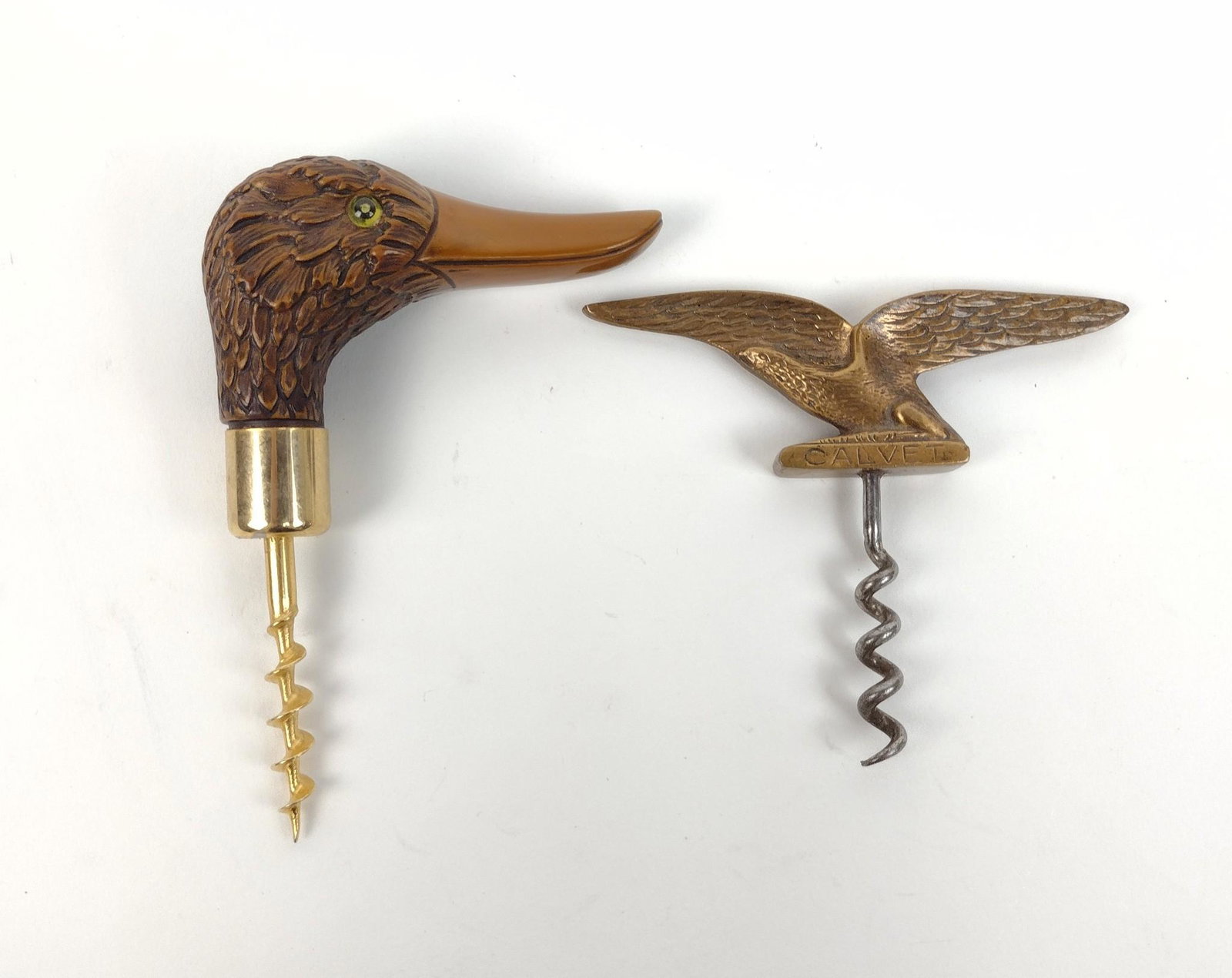 2 Corkscrews incl Carved Mallard: Includes "Calvet" Eagle and wood carved mallard. 3-1/2" to 4" wide X 3-1/2" to 5-1/4" long. MEG IMPORTANT: Before bidding, please read the terms and conditions. When you registered for the auction you