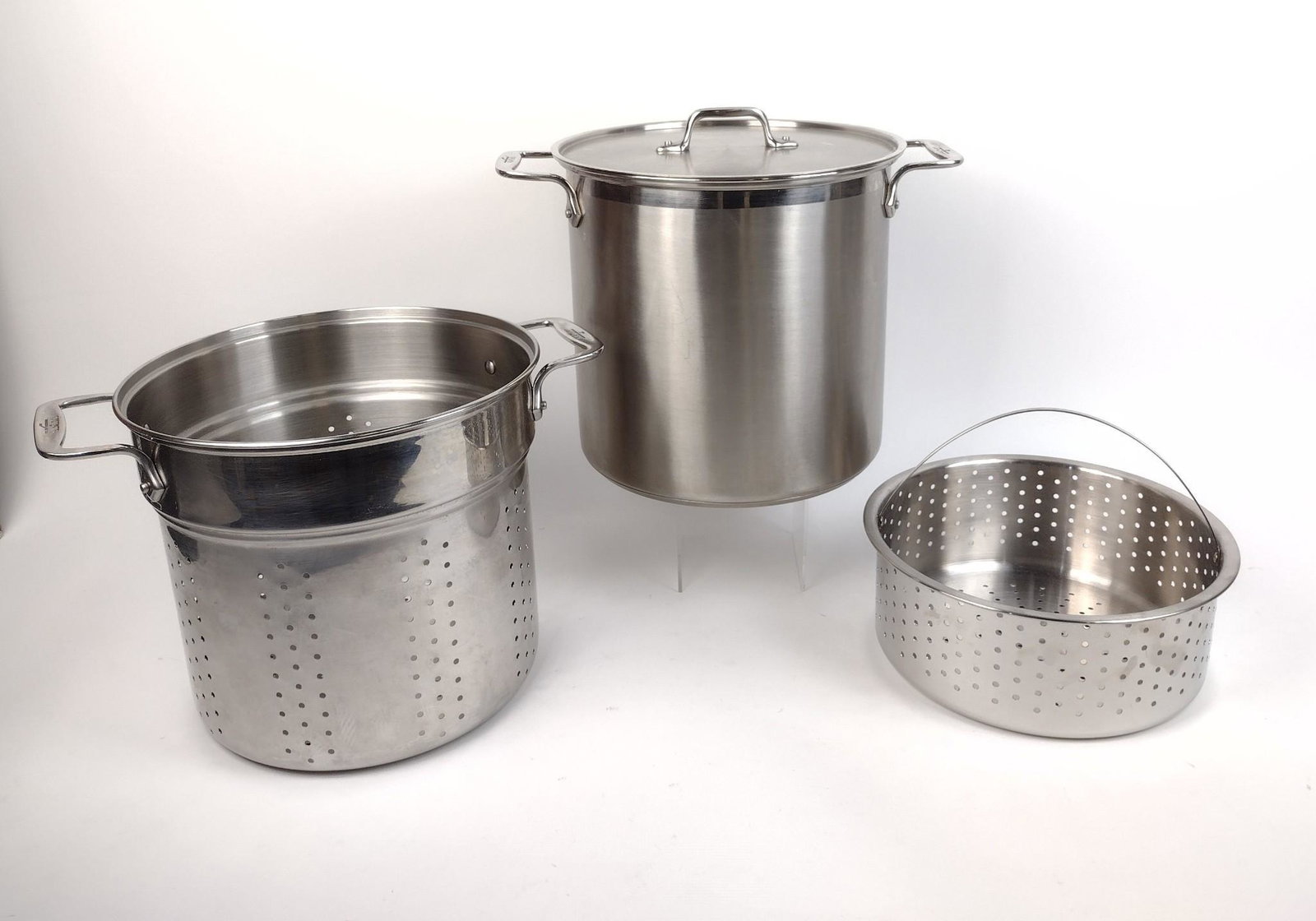 All-Clad 12 Qt. Multi-Cooker: In original box. Box: 14" wide X 11-1/4" deep X 13-1/4" high. MEG From the estate of Lois Lehrman Grass Harrisburg, PA. IMPORTANT: Before bidding, please read the terms and conditions. When you regist