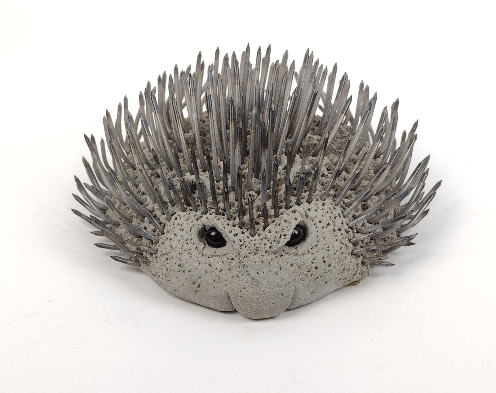 Lou Rankin Concrete & Nail Hedgehog: Lou Rankin was an American sculptor starting in the 1960s. 9-1/2" wide X 4-3/4" high. Bottom: "Rankin 1975". MEG From the estate of Lois Lehrman Grass Harrisburg, PA. IMPORTANT: Before bidding, please