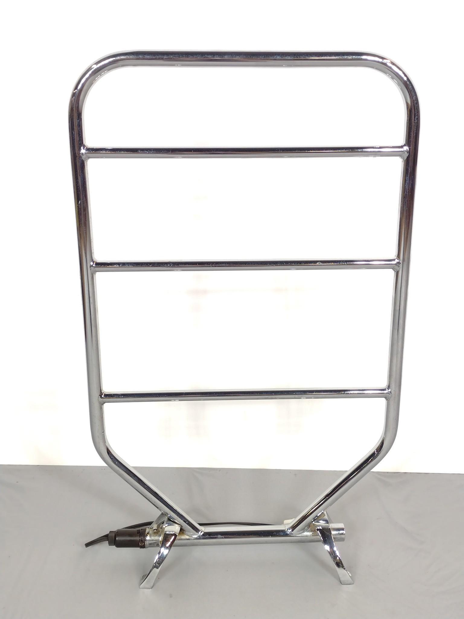 Dimplex Towel Warmer: Model TRC 130. 21" wide X 34-1/2" high. Has some light scratches. Also has spots of rust at base. Working. MG. From the estate of Lois Lehrman Grass Harrisburg, PA. IMPORTANT: Before bidding, please r