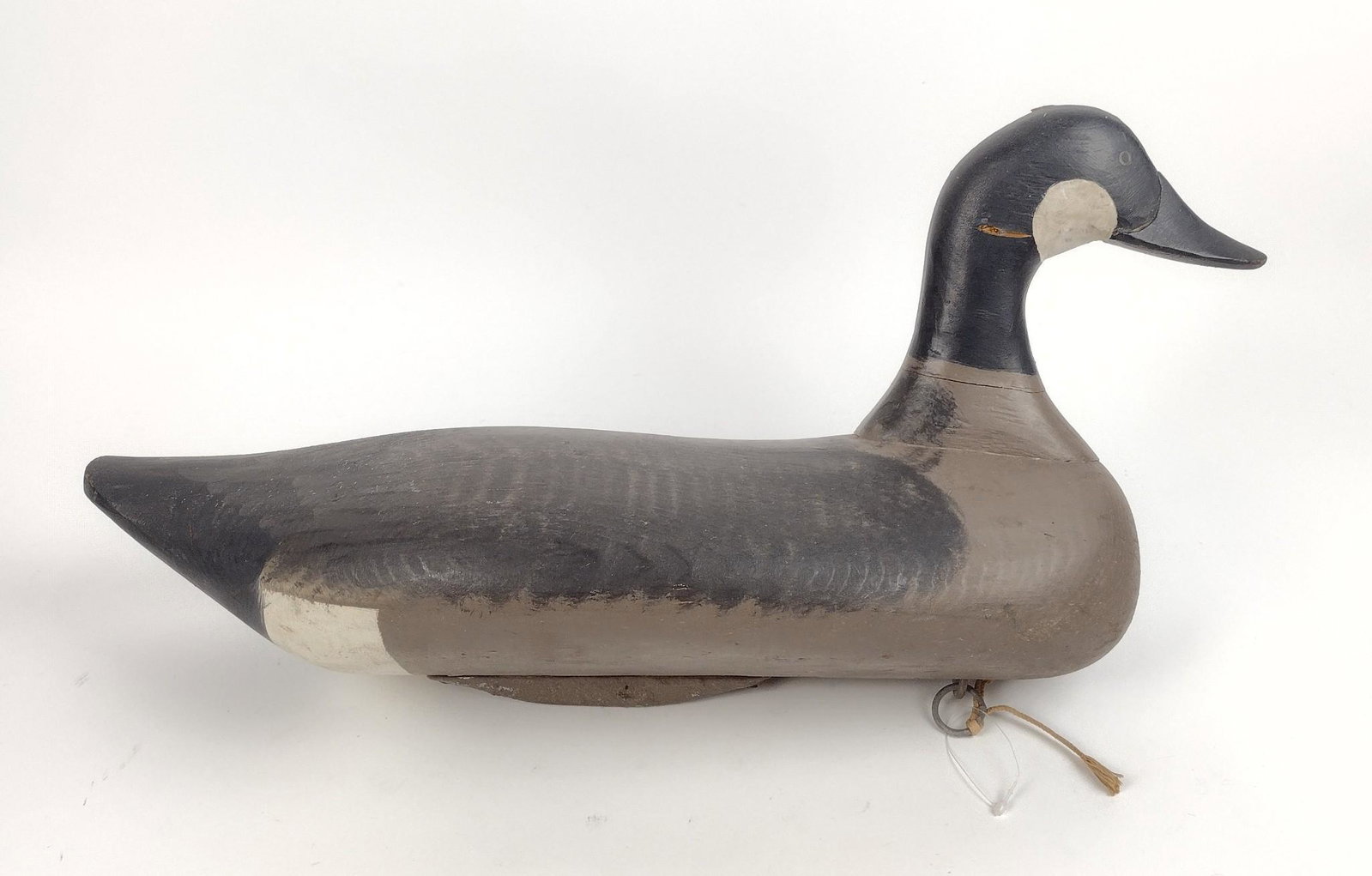 Havre de Grace MD Goose Decoy: 22" long X 10-3/4" high. Some losses to wood on neck. MEG IMPORTANT: Before bidding, please read the terms and conditions. When you registered for the auction you agreed to these terms and will be req