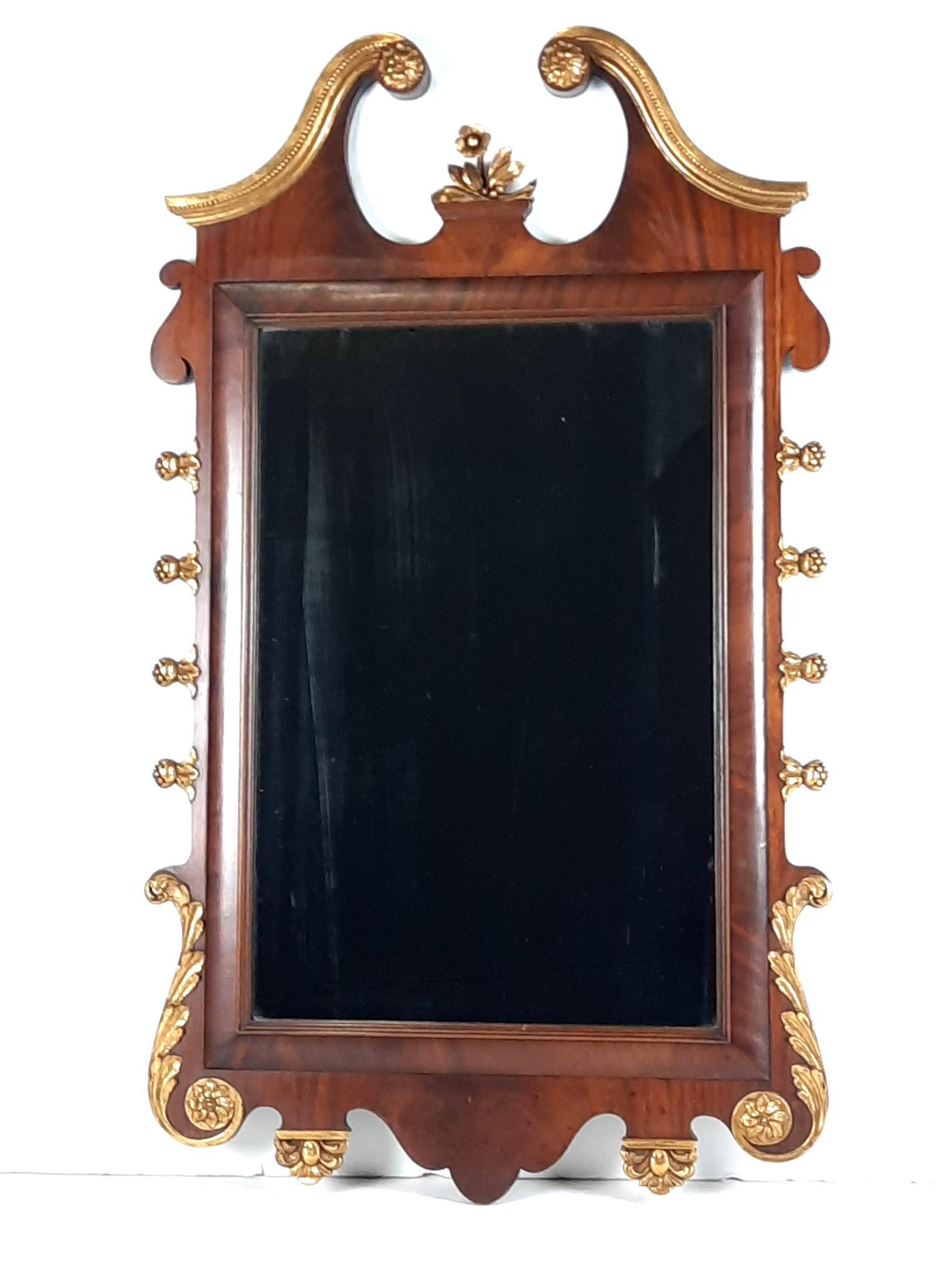 Chippendale Style Mirror: Overall with frame 42-1/2" high x 24-1/2" wide. Some streaking to glass. LR IMPORTANT: Before bidding, please read the terms and conditions. When you registered for the auction you agreed to these ter