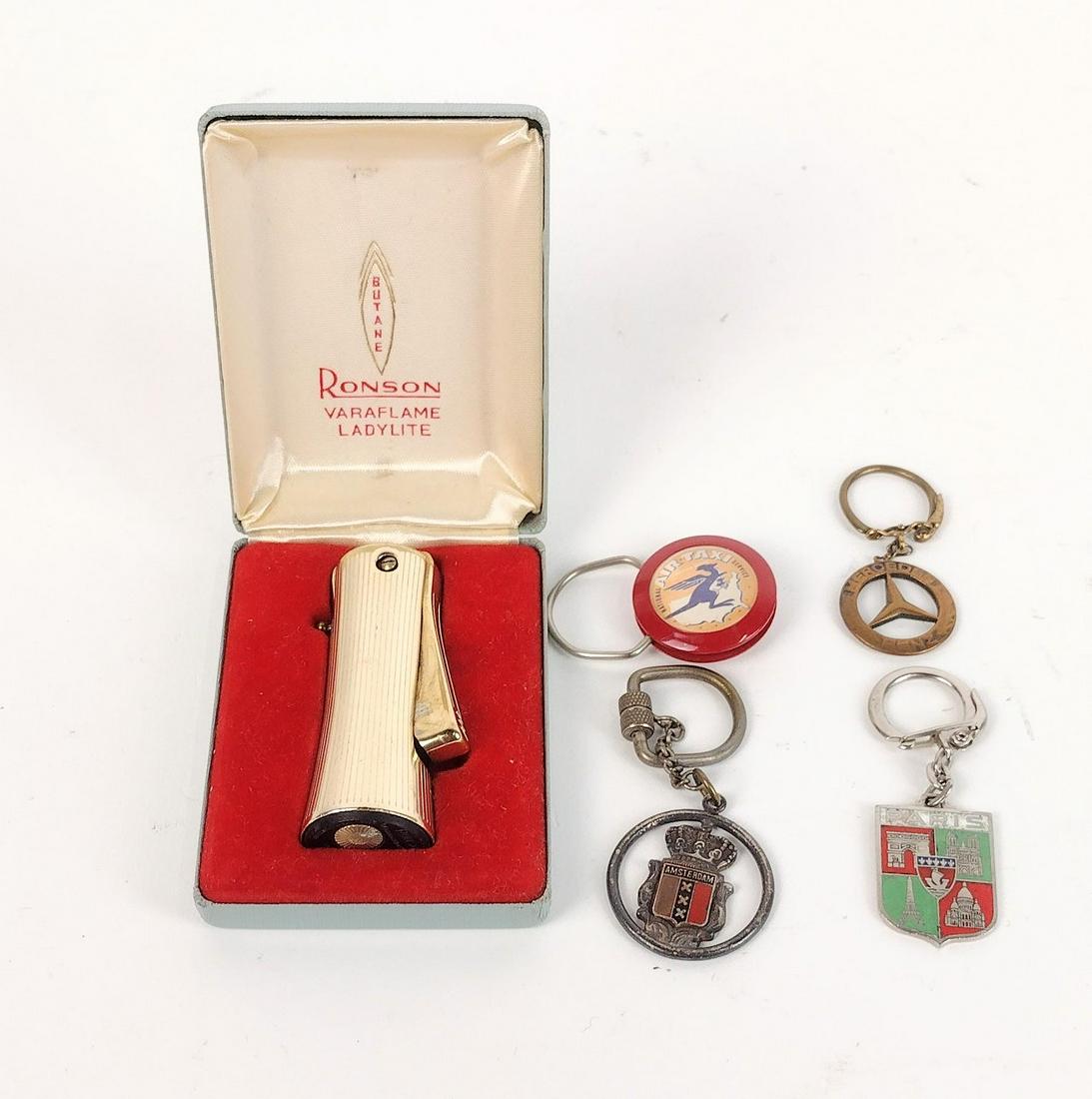 Ronson Veraflame Ladylite & 4 Keychains: Keychains include Amsterdam, Paris, Mercedes Benz, & Air Taxi. MEG IMPORTANT: Before bidding, please read the terms and conditions. When you registered for the auction you agreed to these terms and wi