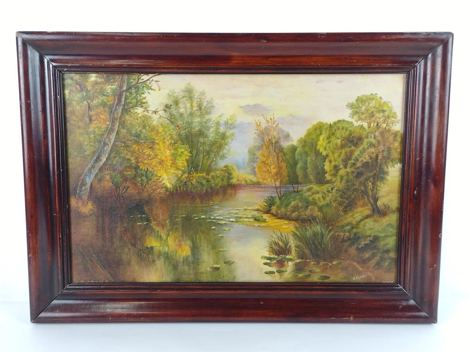 E. Clark Antique Oil Painting Of Stream In Fall: 26-1/4" wide X 19" high. Signed. MG. IMPORTANT: Before bidding, please read the terms and conditions. When you registered for the auction you agreed to these terms and will be required to comply with 