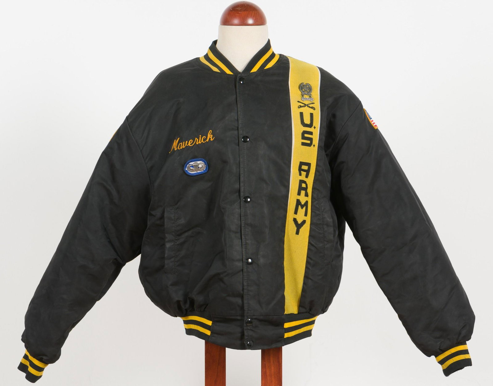 US Army Maverick Bomber Jacket: Description: US Army Maverick jacket. Left side with yellow US Army stripe and US Army rifle marksmanship badge. One shoulder with American Flag patch, other shoulder with United States Army patch. Th