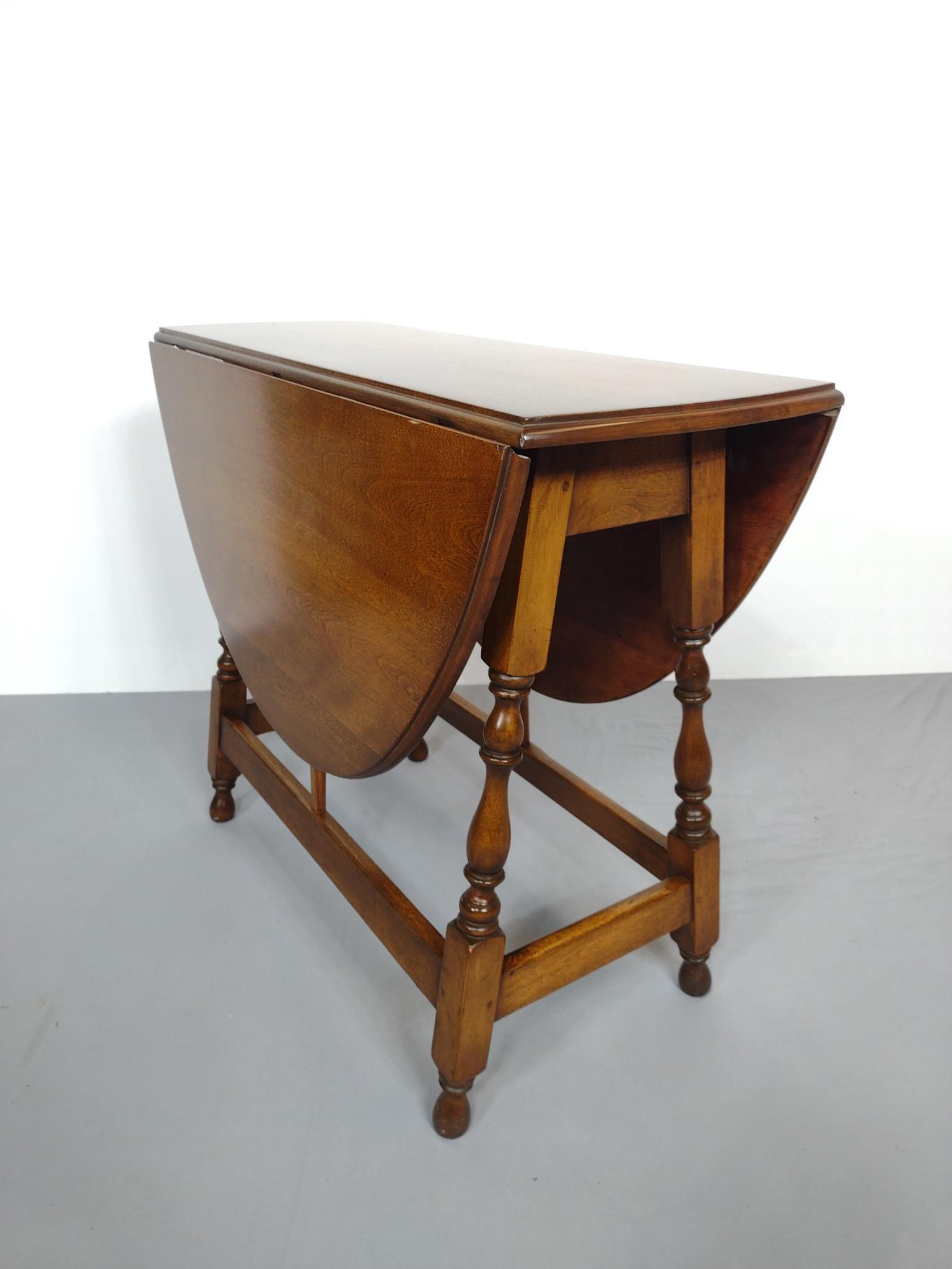 Drop Leaf Table: Open 48", closed 14-1/2" wide X 36" deep X 29-1/4" high. Has a few light scratches. No manufactures name found. MG. IMPORTANT: Before bidding, please read the terms and conditions. When you registered