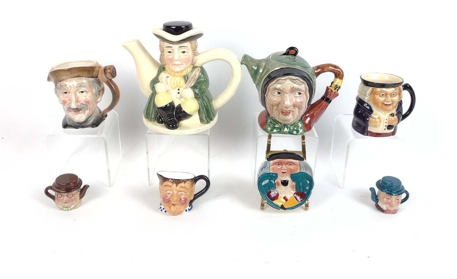 8 Character Mugs & Teapots incl Artone: Also includes Thorley, Shorter & Son Ltd., and Beswick Ware. 2-1/2" to 8" diameter X 2" to 7" high. Crack on bottom of one teapot. MEG IMPORTANT: Before bidding, please read the terms and conditions. 
