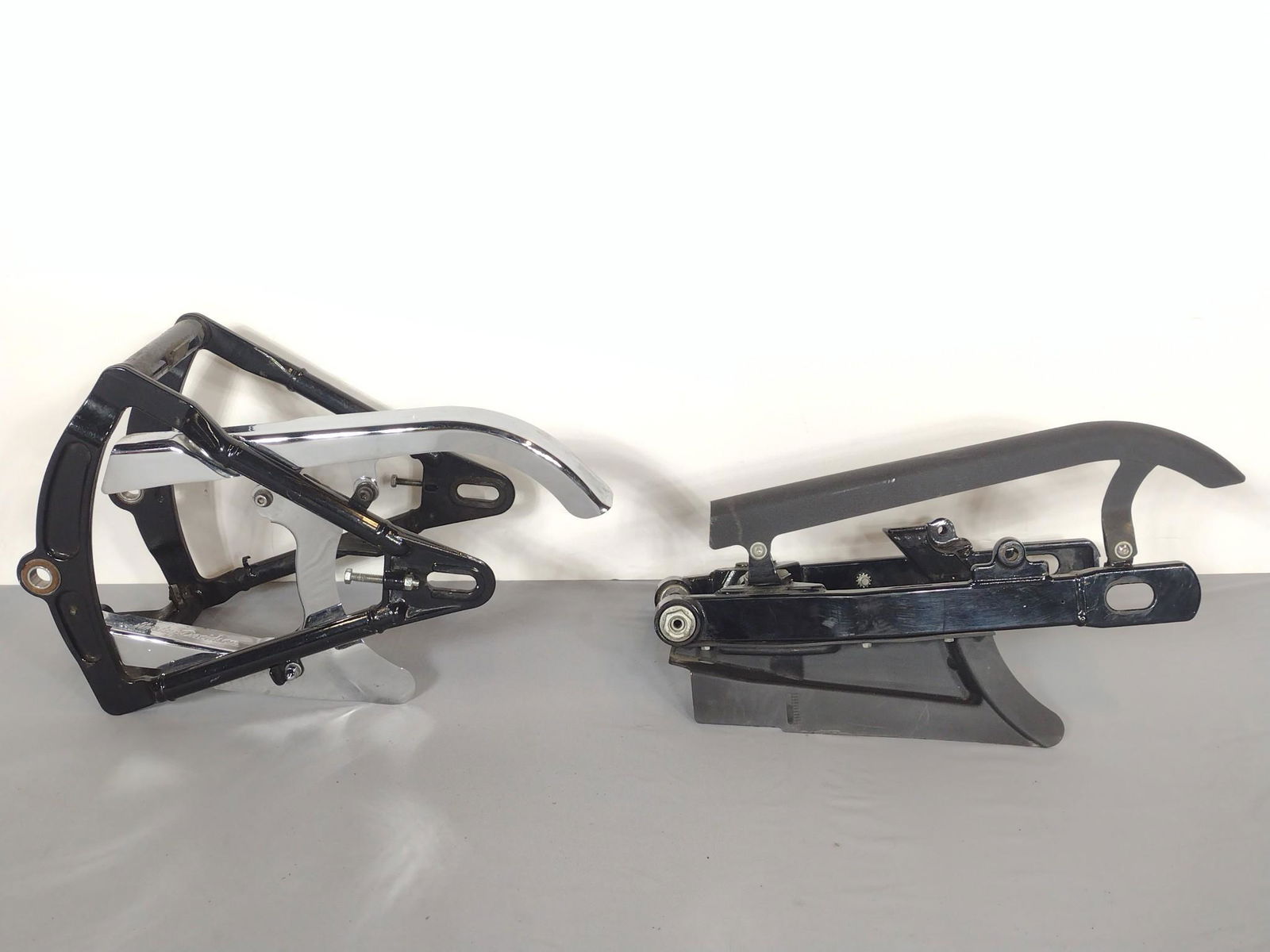 2 Rear Swing Arms Incl Harley Davidson: Harley Davidson 12" wide X 24-1/2" deep X 15" high. All black 12-1/2" wide X 24" deep X 13" high. Both has areas of finish loss. MG. IMPORTANT: Before bidding, please read the terms and conditions. Wh