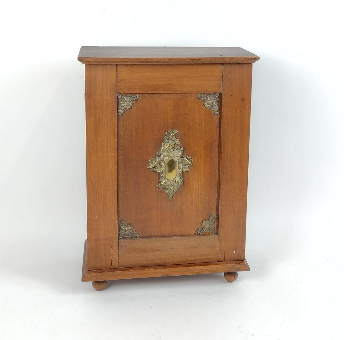 Hanging Wooden Cabinet with Brass Mounts: 13" wide X 6-1/2" deep X 18-1/2" high. MEG IMPORTANT: Before bidding, please read the terms and conditions. When you registered for the auction you agreed to these terms and will be required to comply