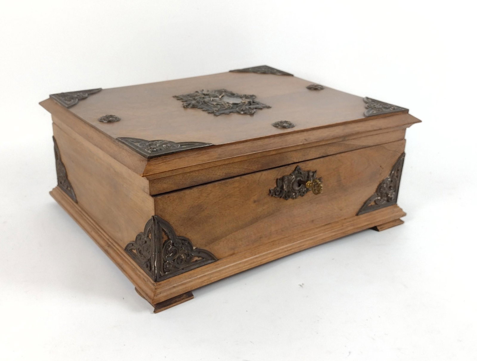 German Wood Box with Figural Brass Mounts: 16-1/2" wide X 14" deep X 6-1/4" high. Crack on bottom. MEG IMPORTANT: Before bidding, please read the terms and conditions. When you registered for the auction you agreed to these terms and will be r