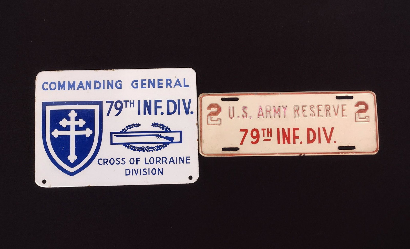 (2) 79th Inf. Div. Porcelain Plaques: Porcelain over metal. 10-1/4" to 11-1/4" wide X 4-1/4" to 7-1/2" long. MEG IMPORTANT: Before bidding, please read the terms and conditions. When you registered for the auction you agreed to these term