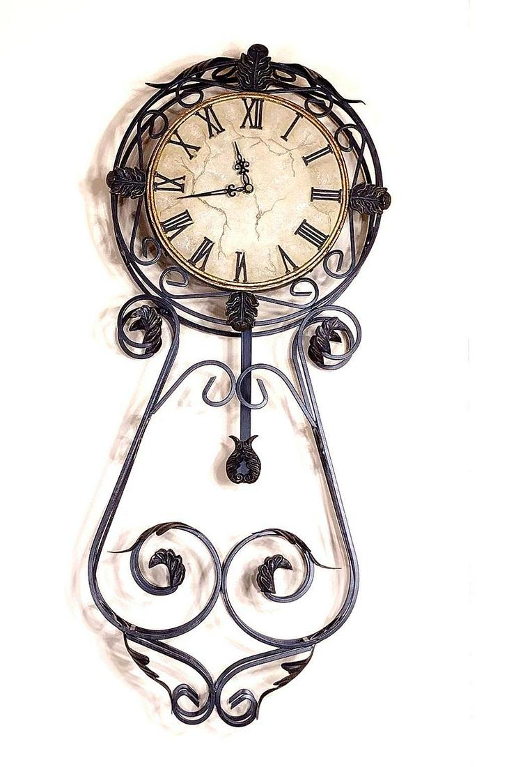 Wall Clock: Working. Battery operated. 12" wide X 29-1/2" high. MEG IMPORTANT: Before bidding, please read the terms and conditions. When you registered for the auction you agreed to these terms and will be requi
