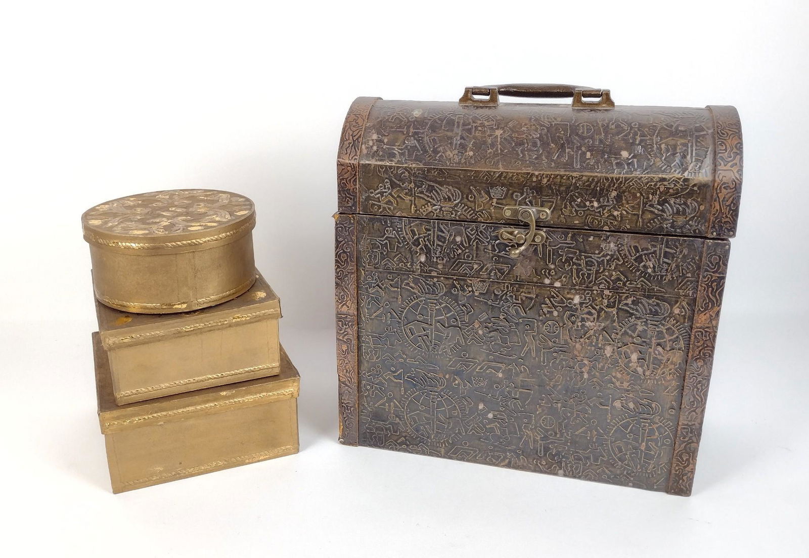 4 Decorative Boxes: Dome top box made of wood. Gilt boxes made of papier mache. 6" to 7-1/2" wide X 3" to 16-1/2" high. Minor finish loss. Tallest box with disconnected hinges. MEG IMPORTANT: Before bidding, please read