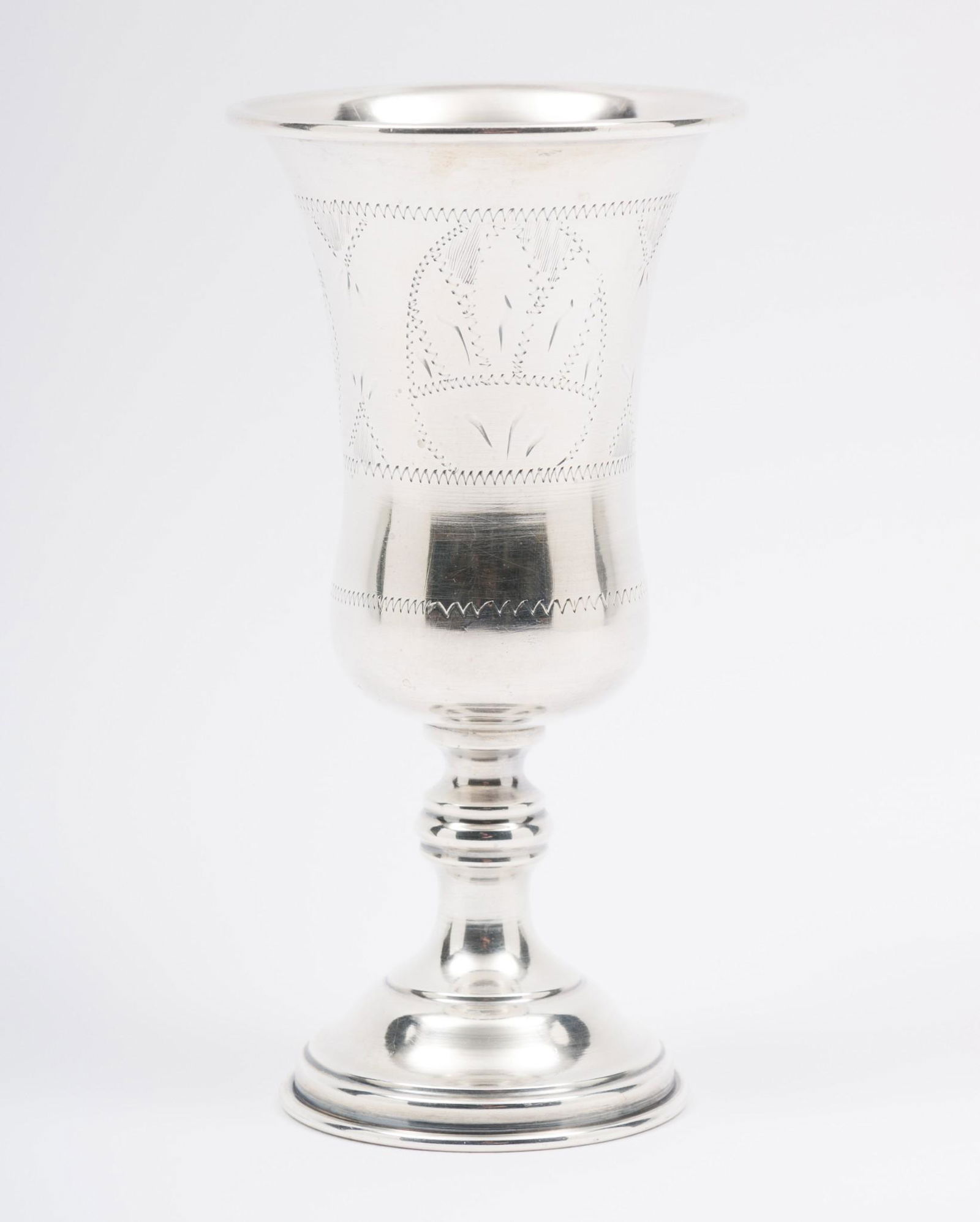 Sterling Jewish Kiddush Chalice: Jewish Kiddush chalice. Marked sterling to bottom edge. Engraving and Star of David along body. 5-1/4" high x 2-3/4" wide. 2.9 ozt. Light scratches to body and edges as expected with careful wear. AJ.