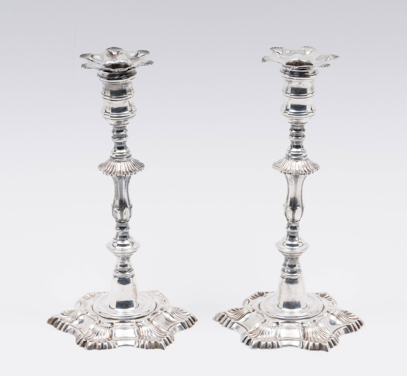 Pr MMA Myer Myers Sterling Candleholders: Pair of sterling candleholders. Marked sterling, Metropolitan Museum Reproduction, Myer Myers New York About 1759. 5-1/2" diameter x 10" high. 24.9 ozt. Scuffing and wear consistent with careful use. 