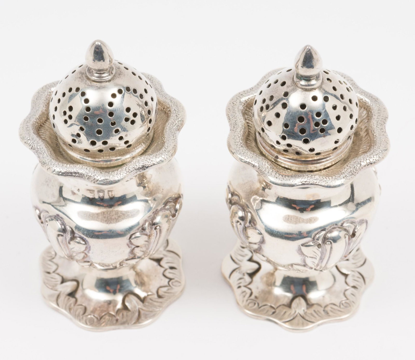 Late 19th C. Sterling Salt & Pepper: Sterling salt and pepper, circa 1895, London. Partial unidentifiable maker's mark. Feather design around bottom. Includes satin lined box. 3-1/2" high. 4.2 ozt. DP. IMPORTANT: Before bidding, please r