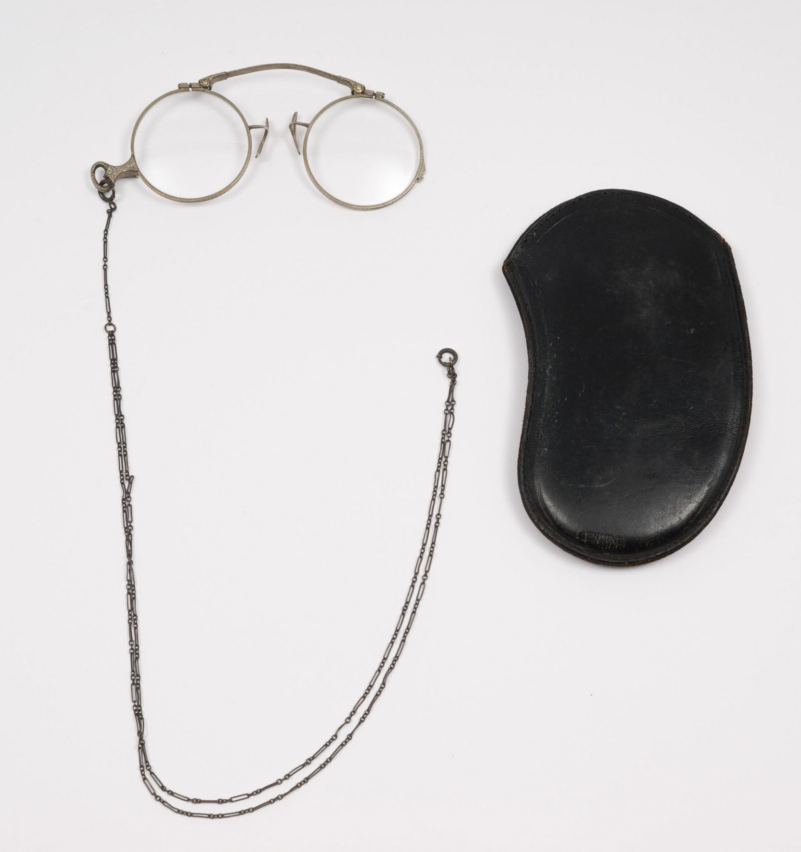 Antique Lorgnette With Case: Lorgnette glasses with leather case and attached chain. Glasses 3-1/2" wide. Light scratching and wear as expected with careful use. AJ. IMPORTANT: Before bidding, please read the terms and conditions