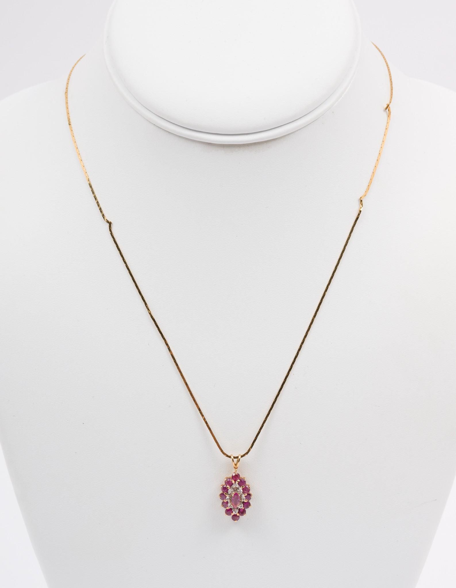 14K Gold, Pink Sapphire & Diamond Pendant Necklace: Marked 14k gold pendant set with center approximately .10 carat marquise cut pink sapphire surrounded by eight approximately .01 carat each round single cut diamonds and twelve approximately .0 carat 