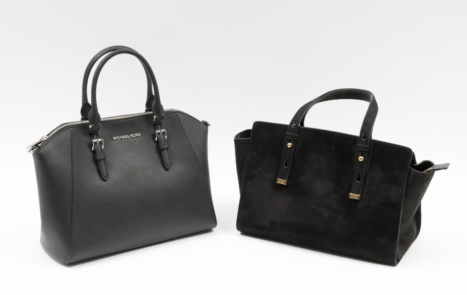 2 Designer Handbags Incl Michael Kors: Also includes Stuart Weitzman. Weitzman with three interior pockets; 13" wide x 7" deep x 9" high with 6" drop. Michael Kors with one large and three small interior pockets; 14" wide x 6" deep x 10" h