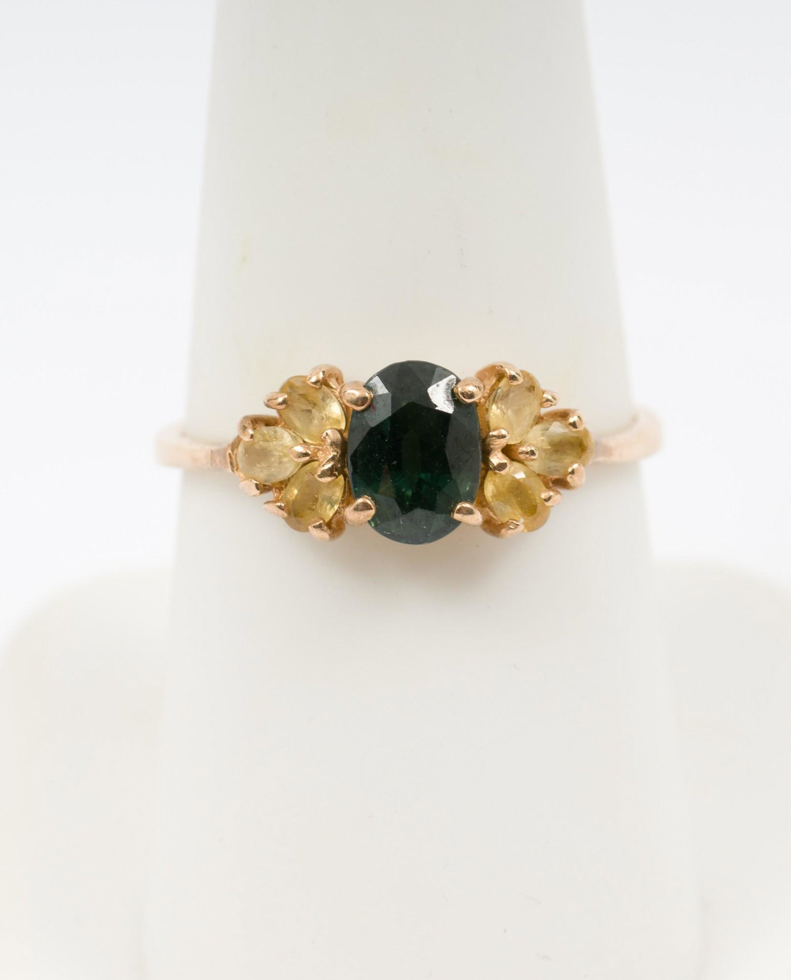 14K Gold & Sapphire Ring: Marked 14k gold ring with center oval cut .51 carat green sapphire and six approximately .15 carat each oval cut yellow sapphires. Size 7. Top 1/4" wide. 1.6 dwt. AJ/EK IMPORTANT: Before bidding, plea