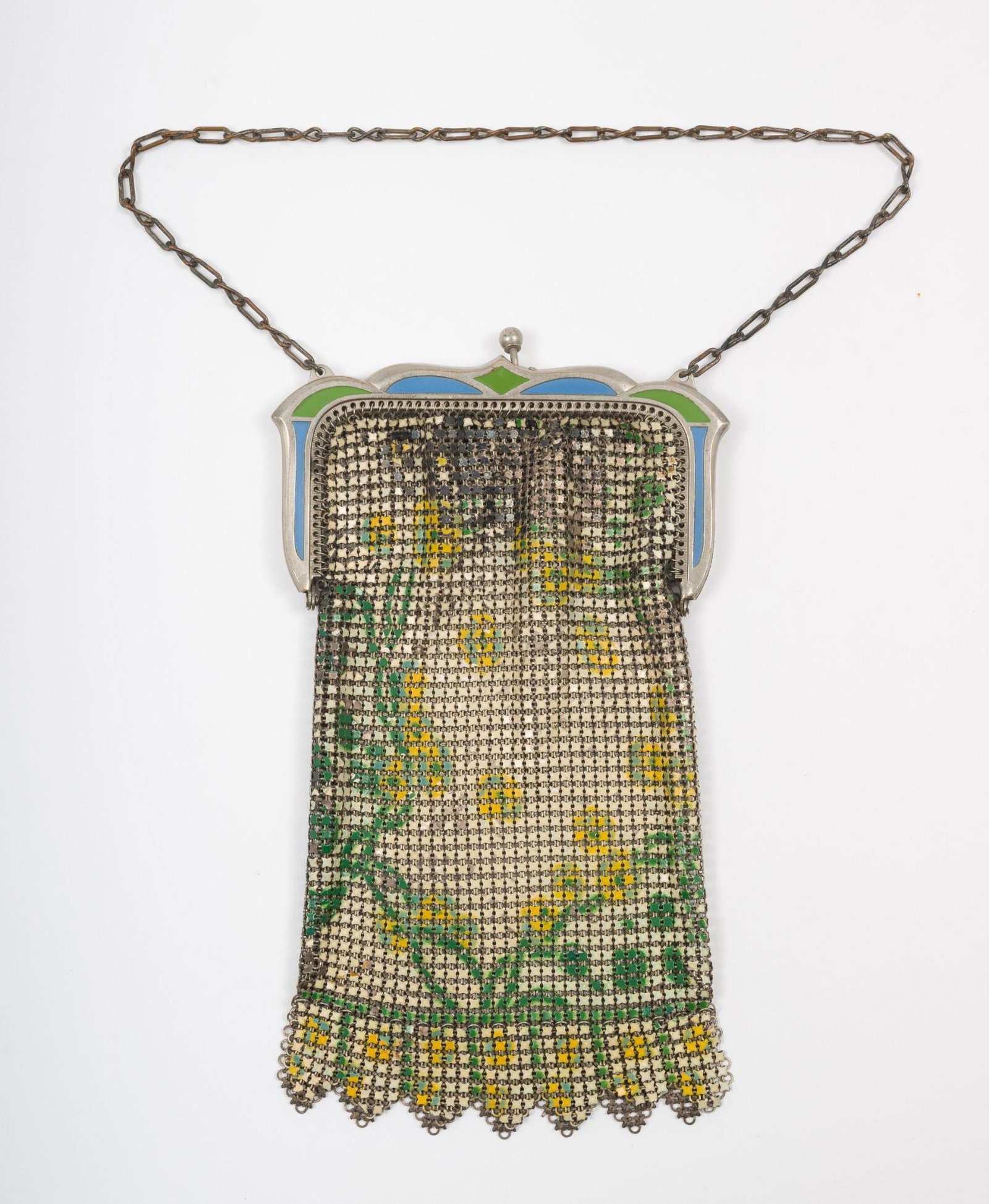 Whiting & Davis Mesh Purse: Whiting & Davis mesh purse with floral design and enamel decorations to top. 6-1/4" high x 3-7/8" wide. Missing one of the clasps. Some of the floral design is missing from the front and back. AJ. IMP