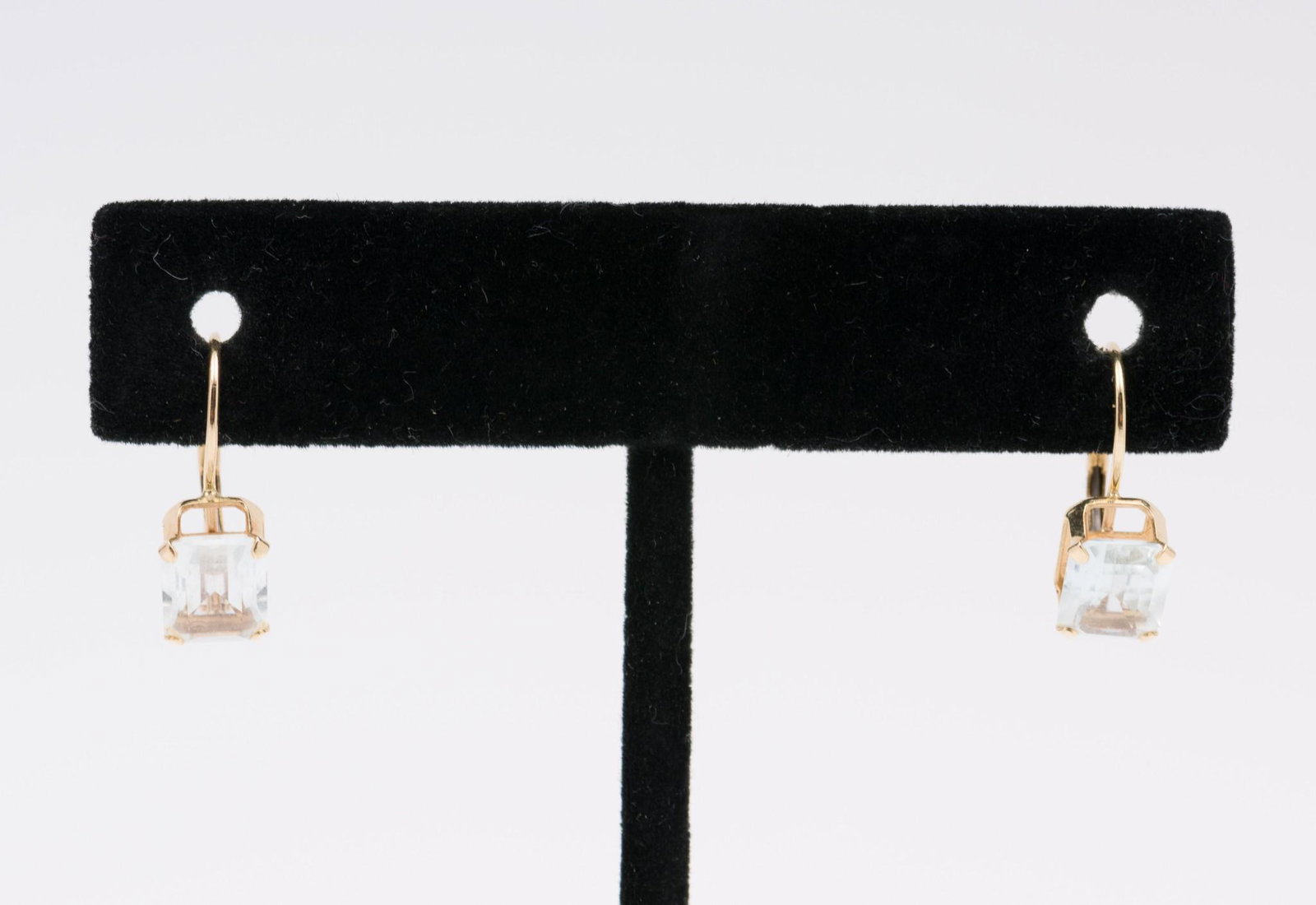 T&C 14K Gold & Aquamarine Earrings: Marked 14k gold earrings each set with approximately 1.3 carat emerald cut aquamarine. Marked T&C, for Town & Country, and 14k. 0.9 dwt. Stones 1/4" high. AJ/EK IMPORTANT: Before bidding, please read 