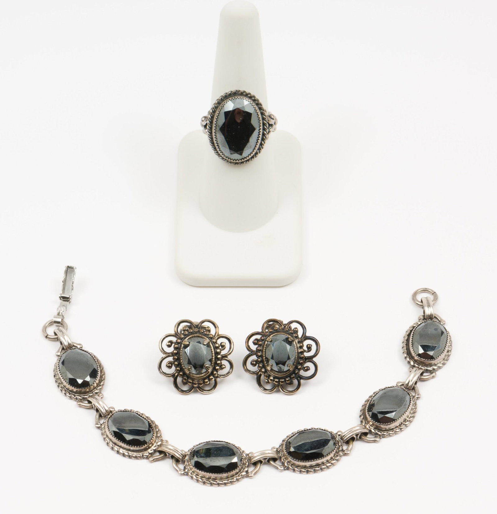 Danecraft Sterling and Hematite Bracelet, Ring, and Earrings: Ring and bracelet Sterling and for Danecraft. Earrings unmarked. Ring size 6-1/2, 7/8" wide. Bracelet 6-1/2" long. Clip on earrings 3/4" long. MH. IMPORTANT: Before bidding, please read the terms and