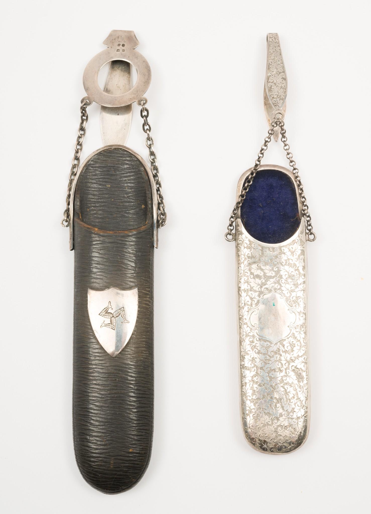 2 Spectacle Cases: Leather and Sterling case. Has the emblem for Isle of Man on front. One chatelaine. 1-1/4" to 1-3/4" wide x 5-1/4" to 6-12" long. MEG IMPORTANT: Before bidding, please read the terms and conditions. W