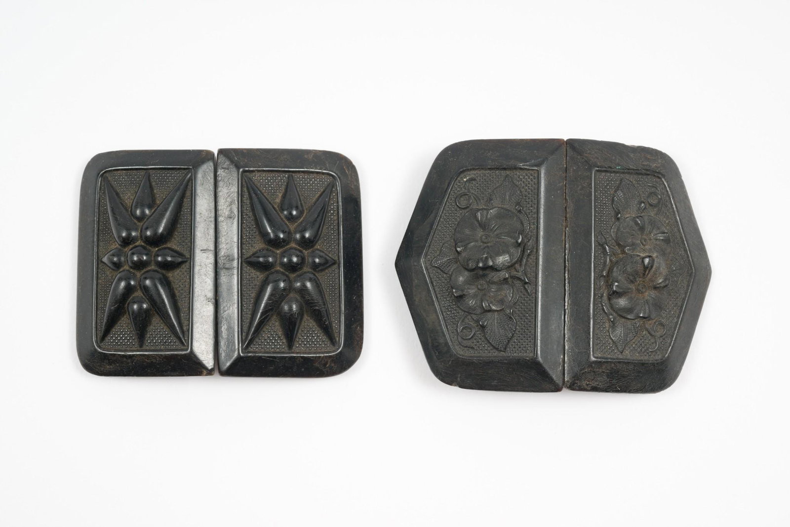 2 Pairs of Cloak Closures: Both bakelite floral design cloak closures. 1-1/4" to 1-1/2" wide x 2" to 2-1/4" long. Back of one pair has some cracking. MEG IMPORTANT: Before bidding, please read the terms and conditions. When you