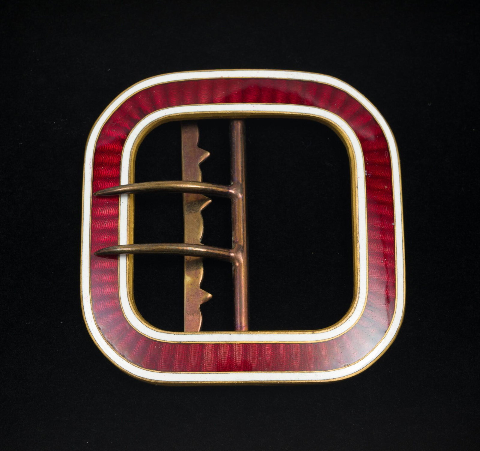 Red Enamel Belt Buckle: Red enamel with white trim belt buckle. 2-1/2" wide x 2-3/4" long. MEG IMPORTANT: Before bidding, please read the terms and conditions. When you registered for the auction you agreed to these terms an