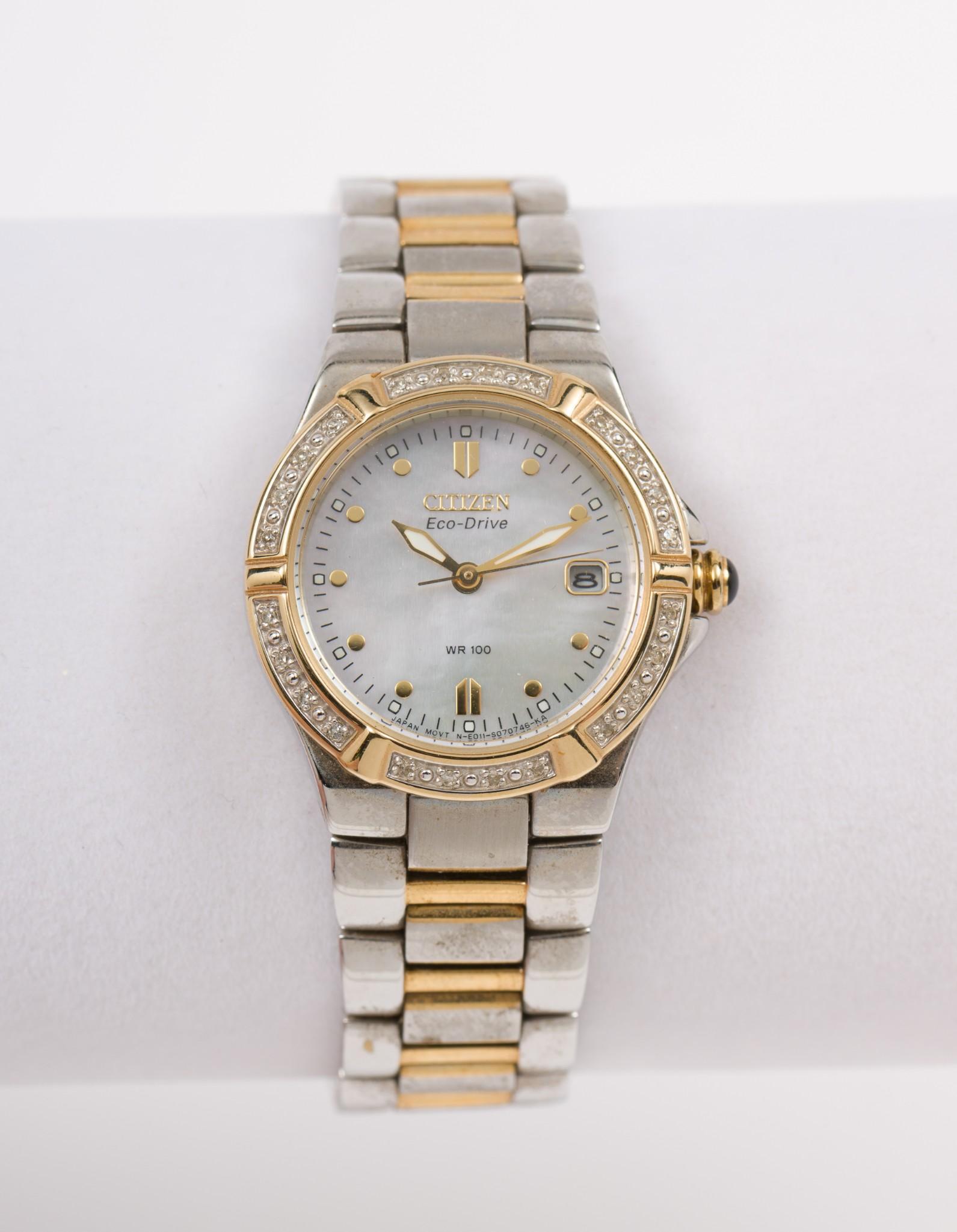Citizen Eco-Drive Women's Wristwatch: Citizen Eco-Drive wristwatch with stainless steel band. Serial number 950259. Lug to lug 1-1/4" long. With replacement links. In original box. Some wear to the band and back of the watch face. MEG IMP