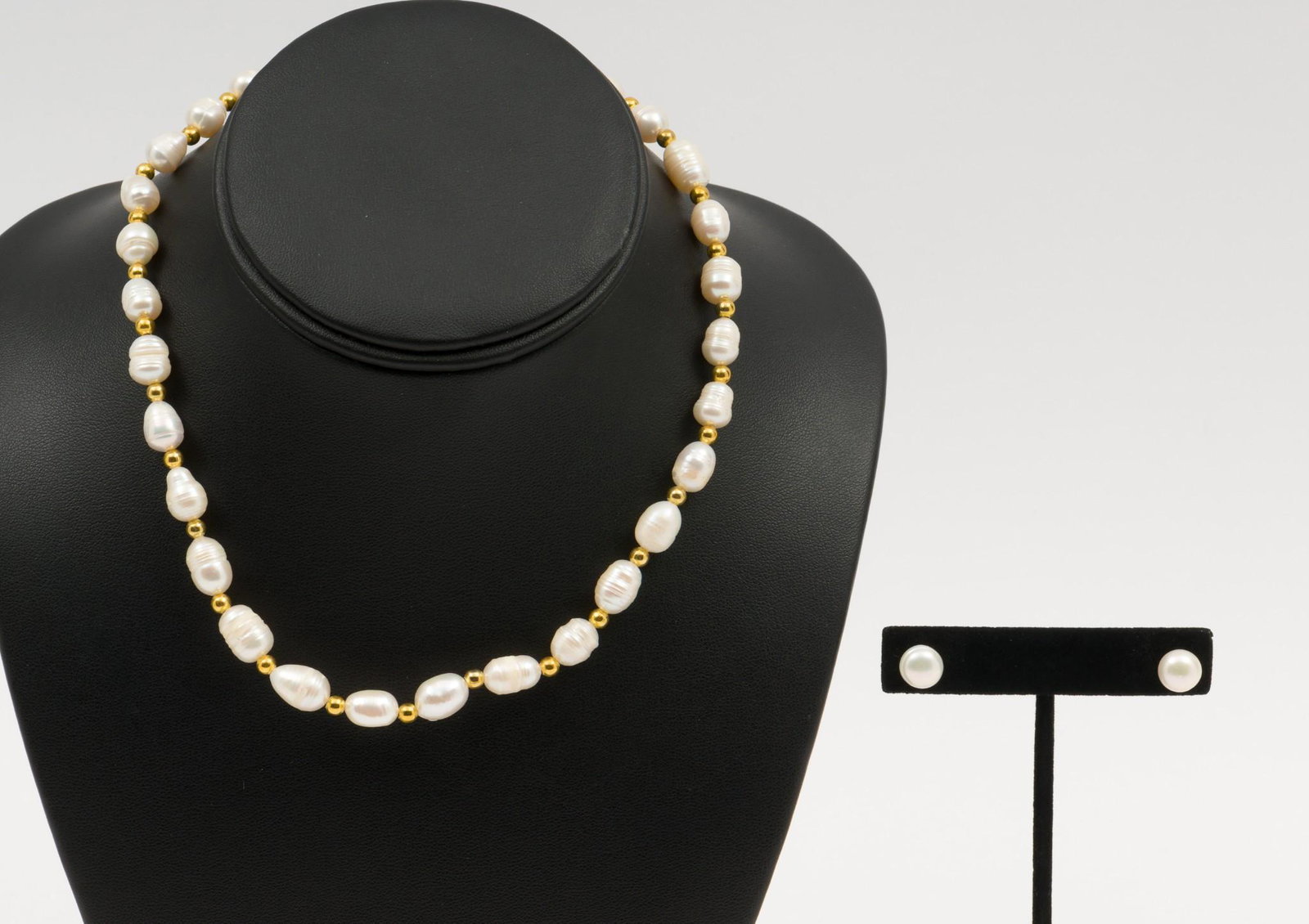Pearl Necklace & Earrings: Includes pearl necklace with gold-plated beads and pair of pearl stud pierced earrings. Necklace: 16" long. Earrings: 3/4" long. MEG/EK IMPORTANT: Before bidding, please read the terms and conditions.