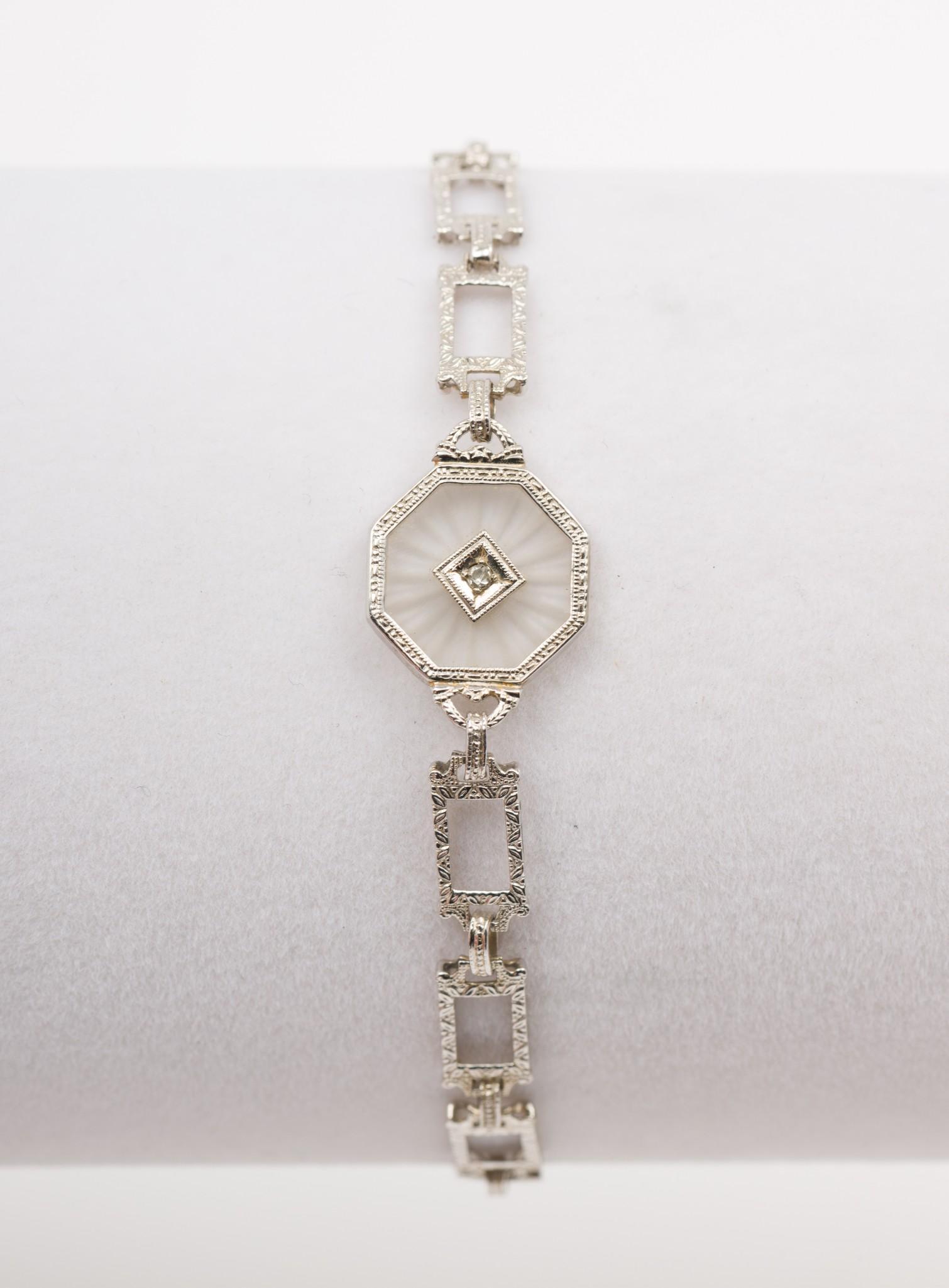 10k White Gold Filagree Bracelet: Marked 10k. 2.6 dwt. 1/2" wide x 7-1/2" long. MEG IMPORTANT: Before bidding, please read the terms and conditions. When you registered for the auction you agreed to these terms and will be required to