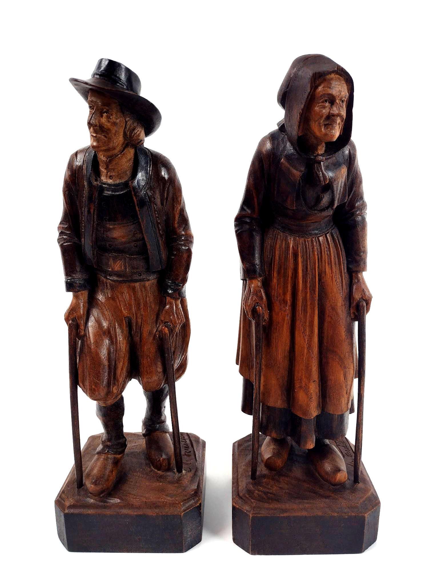 2 Maurice Fouillen Wood Carved Figurines: 3-3/4" wide X 3-1/2" deep X 11-1/2" high. EL From the estate of Robert Harman. IMPORTANT: Before bidding, please read the terms and conditions. When you registered for the auction you agreed to these 