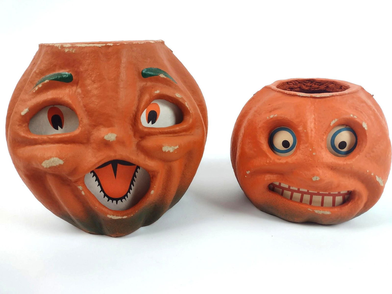 2 Seasons Gone By Jack-O-Lanterns: Made of papier mache. 6" to 7-1/2" wide X 6-1/2" deep X 5" to 7" high. EL From the estate of Robert Harman. IMPORTANT: Before bidding, please read the terms and conditions. When you registered for the