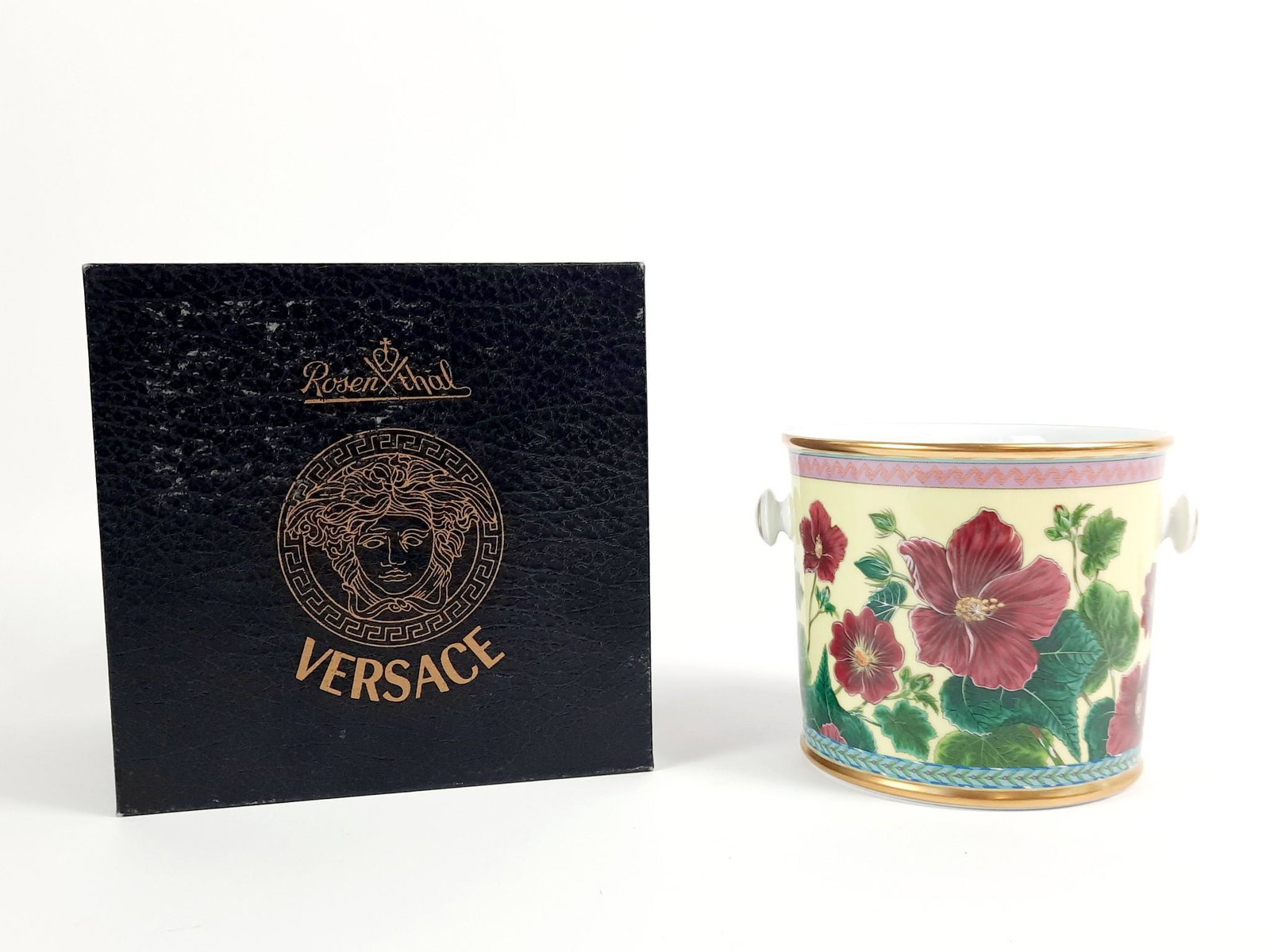 Rosenthal "Tropical Wonderland" Versace Cachepot: Original box included. 7-1/4" wide x 6-1/2" deep x 5-3/4" high. LR From the estate of Robert Harman. IMPORTANT: Before bidding, please read the terms and conditions. When you registered for the auctio
