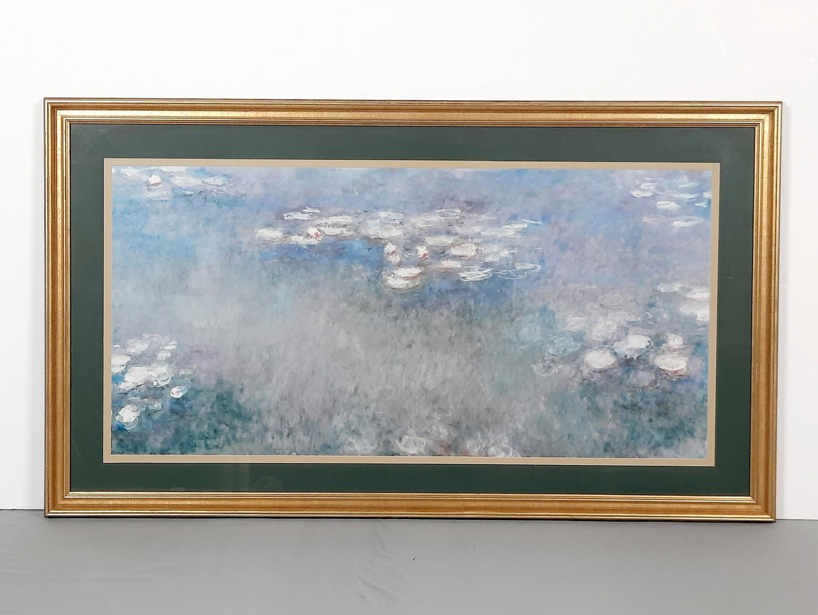 Monet Water Lilies Print: Overall with frame 34" high x 58" wide. LR IMPORTANT: Before bidding, please read the terms and conditions. When you registered for the auction you agreed to these terms and will be required to comply