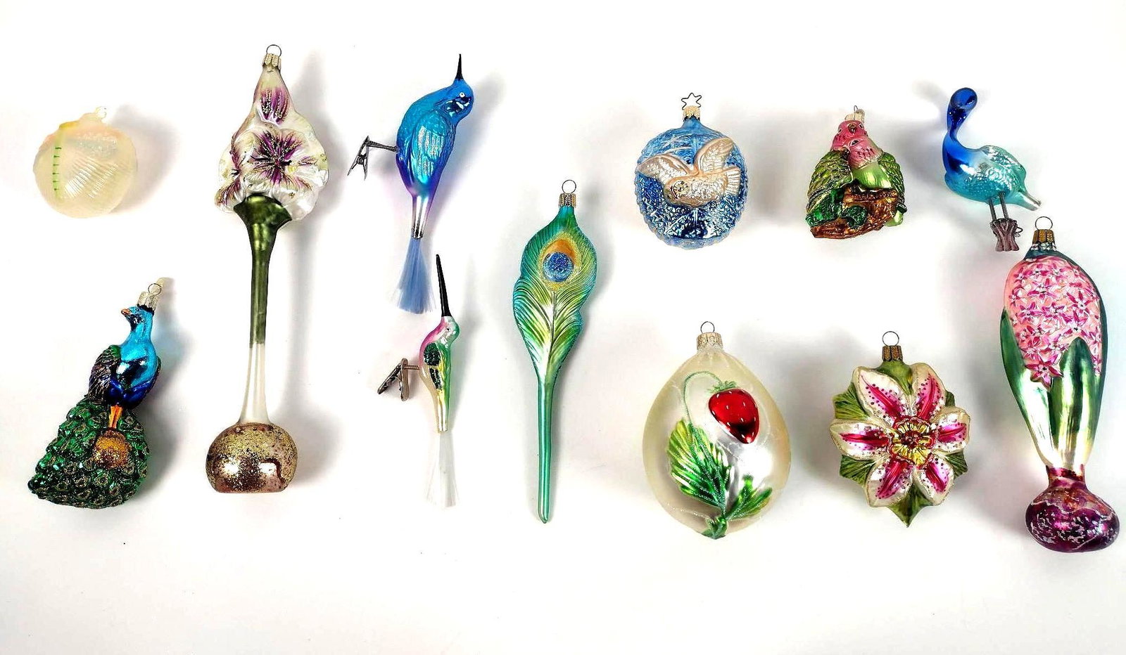 12 Flower and Bird Christmas Ornaments: 2" to 12" high. EL From the estate of Robert Harman. IMPORTANT: Before bidding, please read the terms and conditions. When you registered for the auction you agreed to these terms and will be required