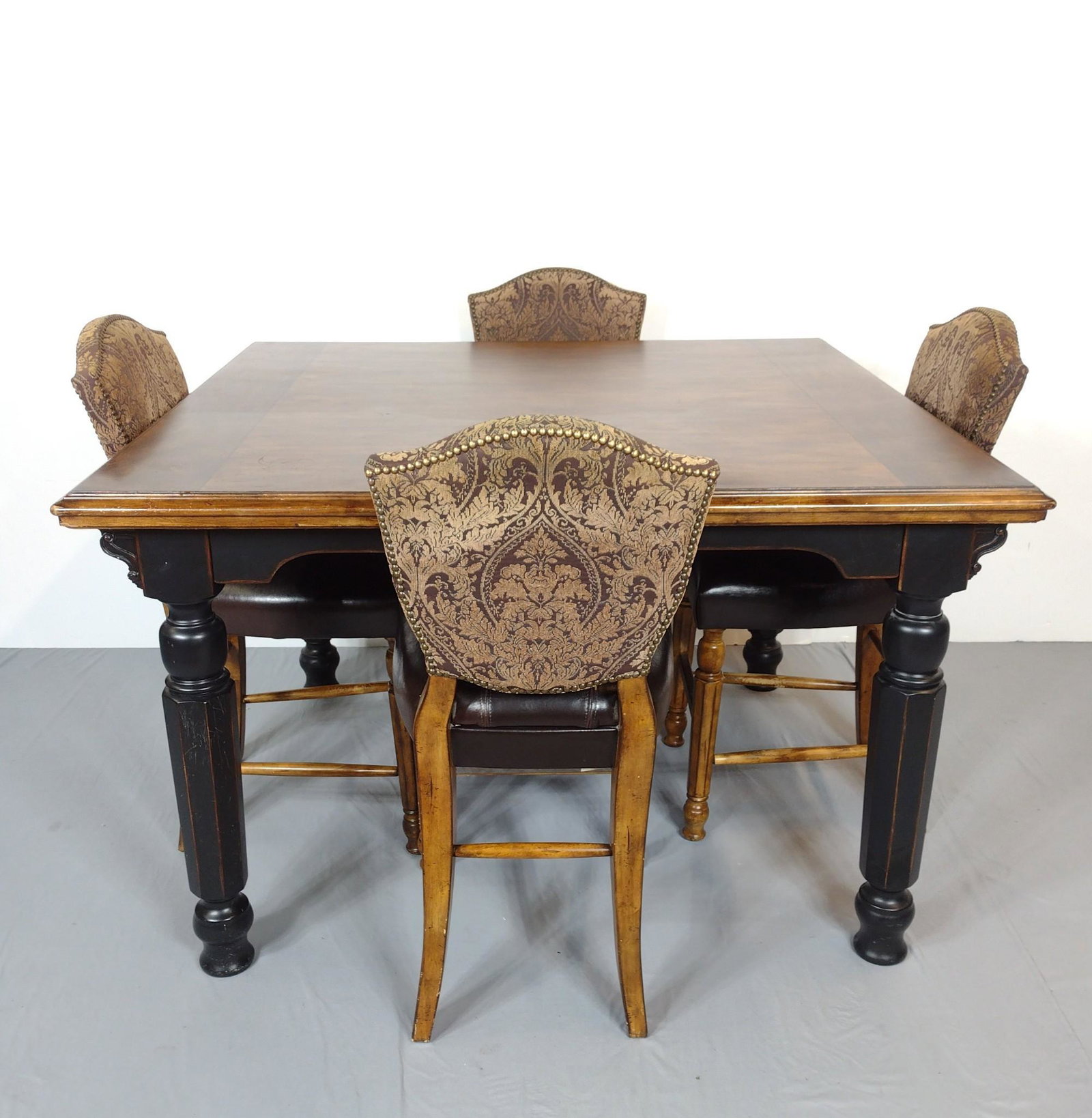 Ashley Furniture High Top Table With 4 Chairs: Table 58" wide X 54" deep X 36" high. Chairs 19-1/2" wide X 23" deep X 42" high. Table has some scratches. Vinyl on chairs has cracking and some loss. MG. IMPORTANT: Before bidding, please read the te