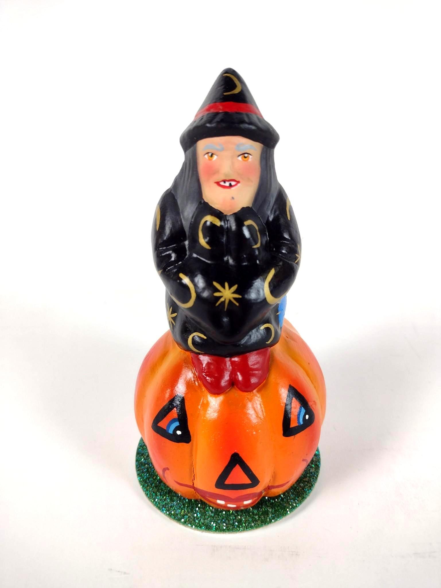 5-1/2" Ino Schaller Witch on Pumpkin Figurine: Made of papier mache. 3" diameter X 5-1/2" high. EL From the estate of Robert Harman. IMPORTANT: Before bidding, please read the terms and conditions. When you registered for the auction you agreed to